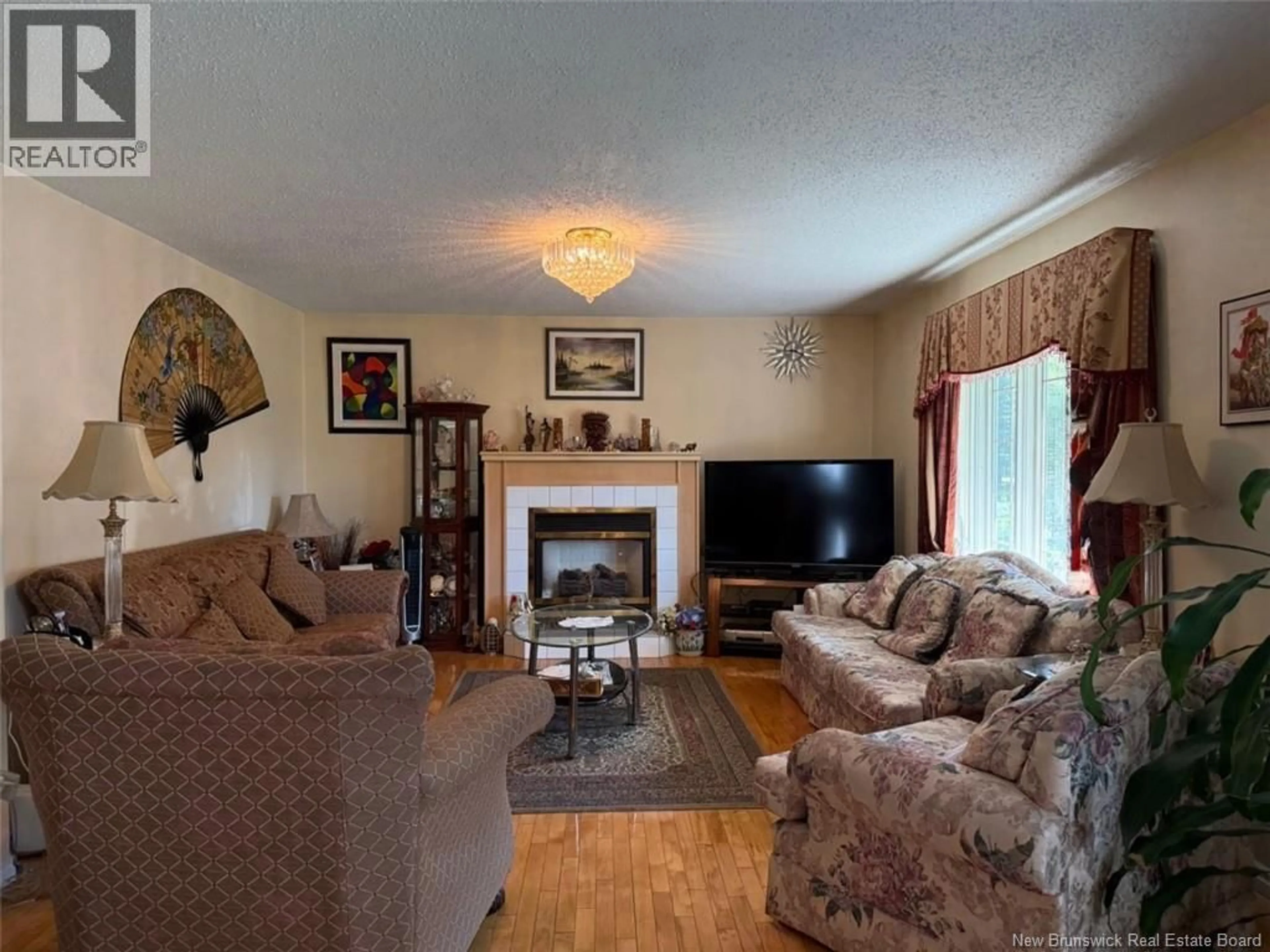 Living room with furniture, wood/laminate floor for 6 BROOK TERRACE, Campbellton New Brunswick E3N3T3