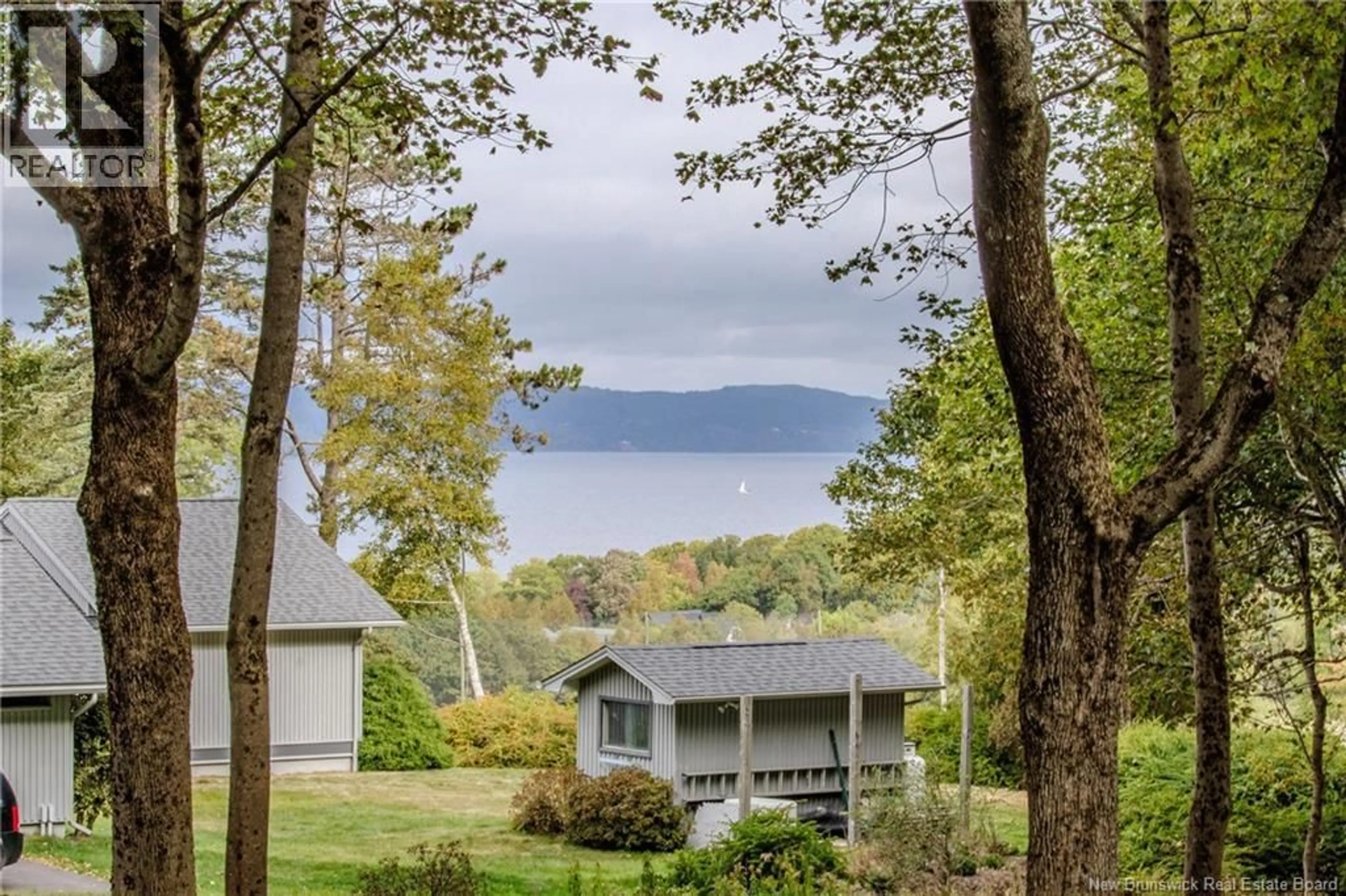A pic from outside/outdoor area/front of a property/back of a property/a pic from drone, water/lake/river/ocean view for 3 VALPY DRIVE, Rothesay New Brunswick E2H1V2
