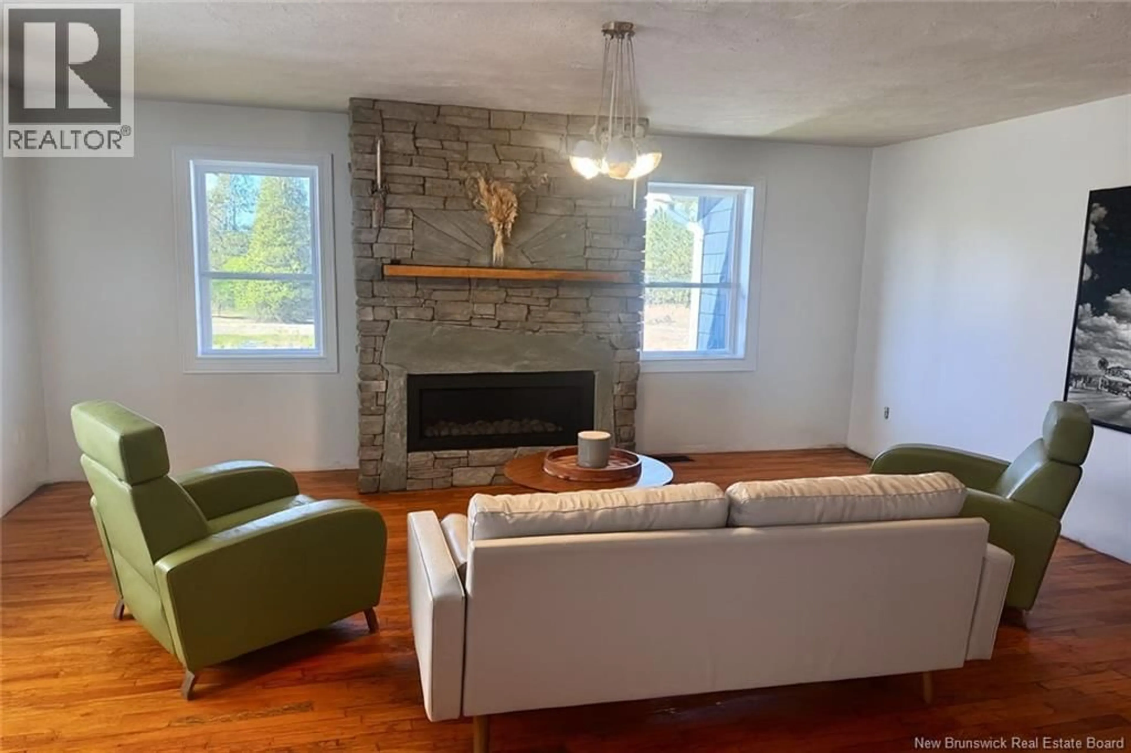 Living room with furniture, wood/laminate floor for 10 DE LA BRECHE ROAD, Beaubassin East New Brunswick E4P7B8