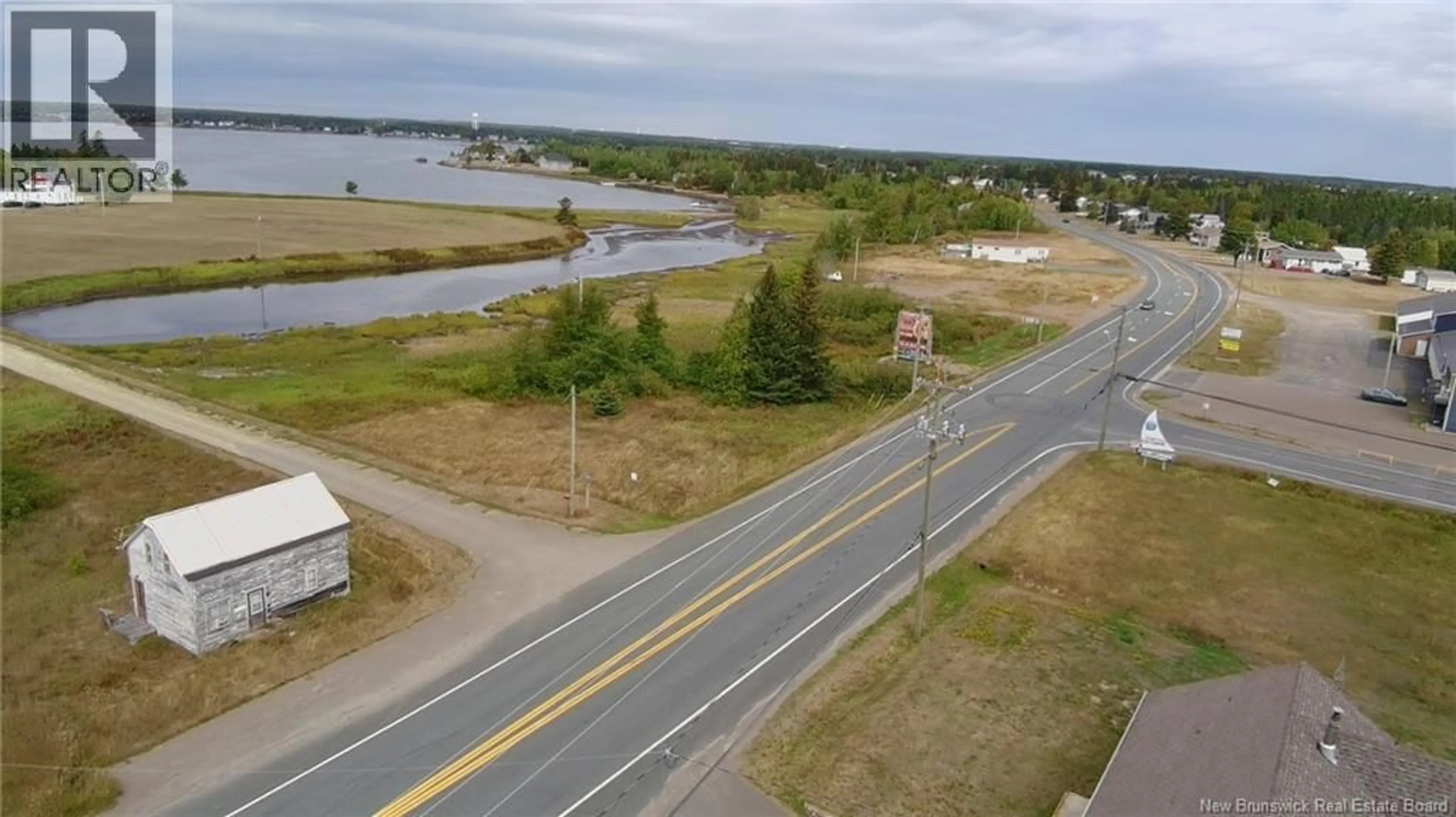 A pic from outside/outdoor area/front of a property/back of a property/a pic from drone, water/lake/river/ocean view for 7247 ROUTE 11, Tracadie New Brunswick E1X3E1