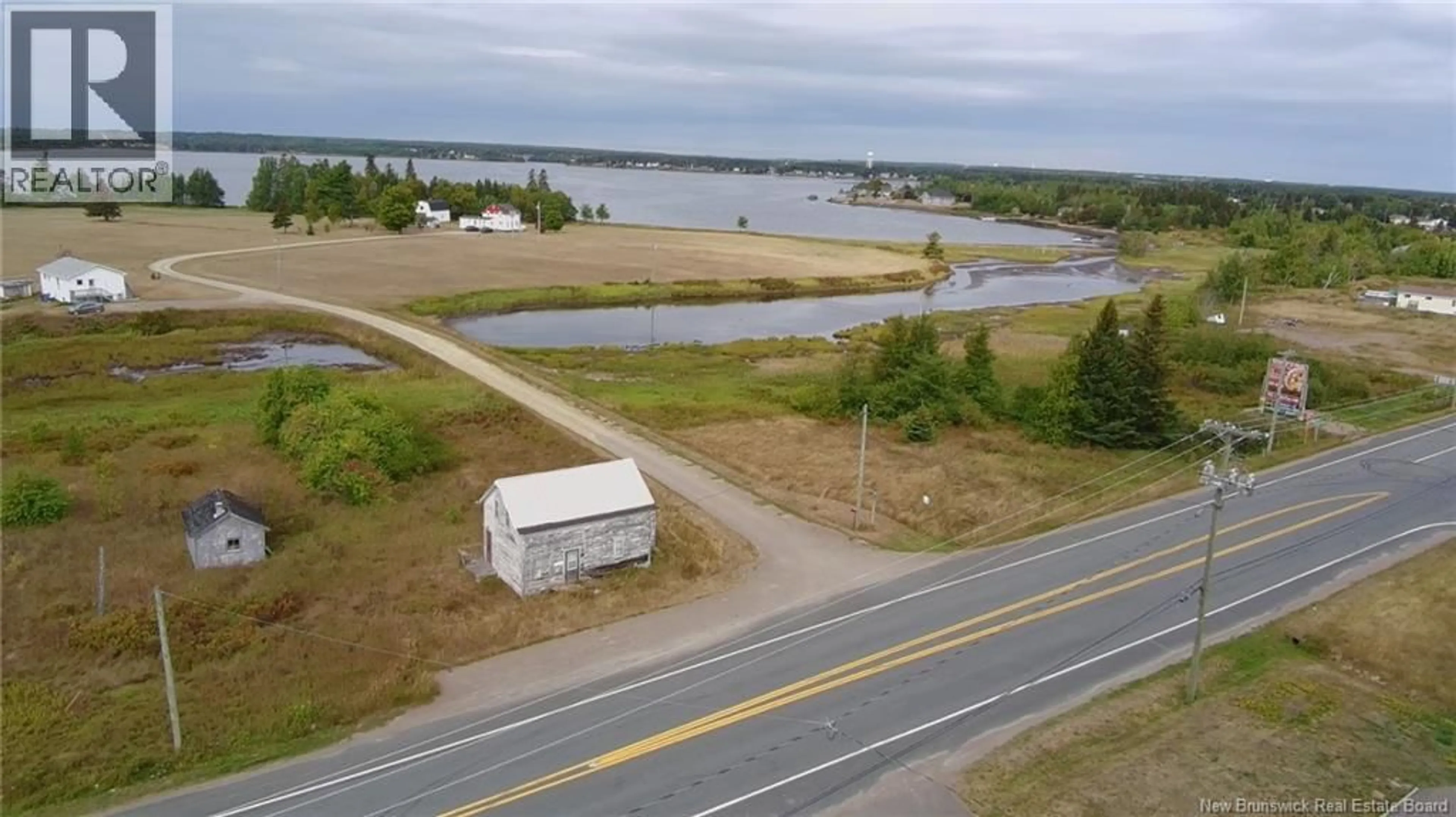A pic from outside/outdoor area/front of a property/back of a property/a pic from drone, water/lake/river/ocean view for 7247 ROUTE 11, Tracadie New Brunswick E1X3E1