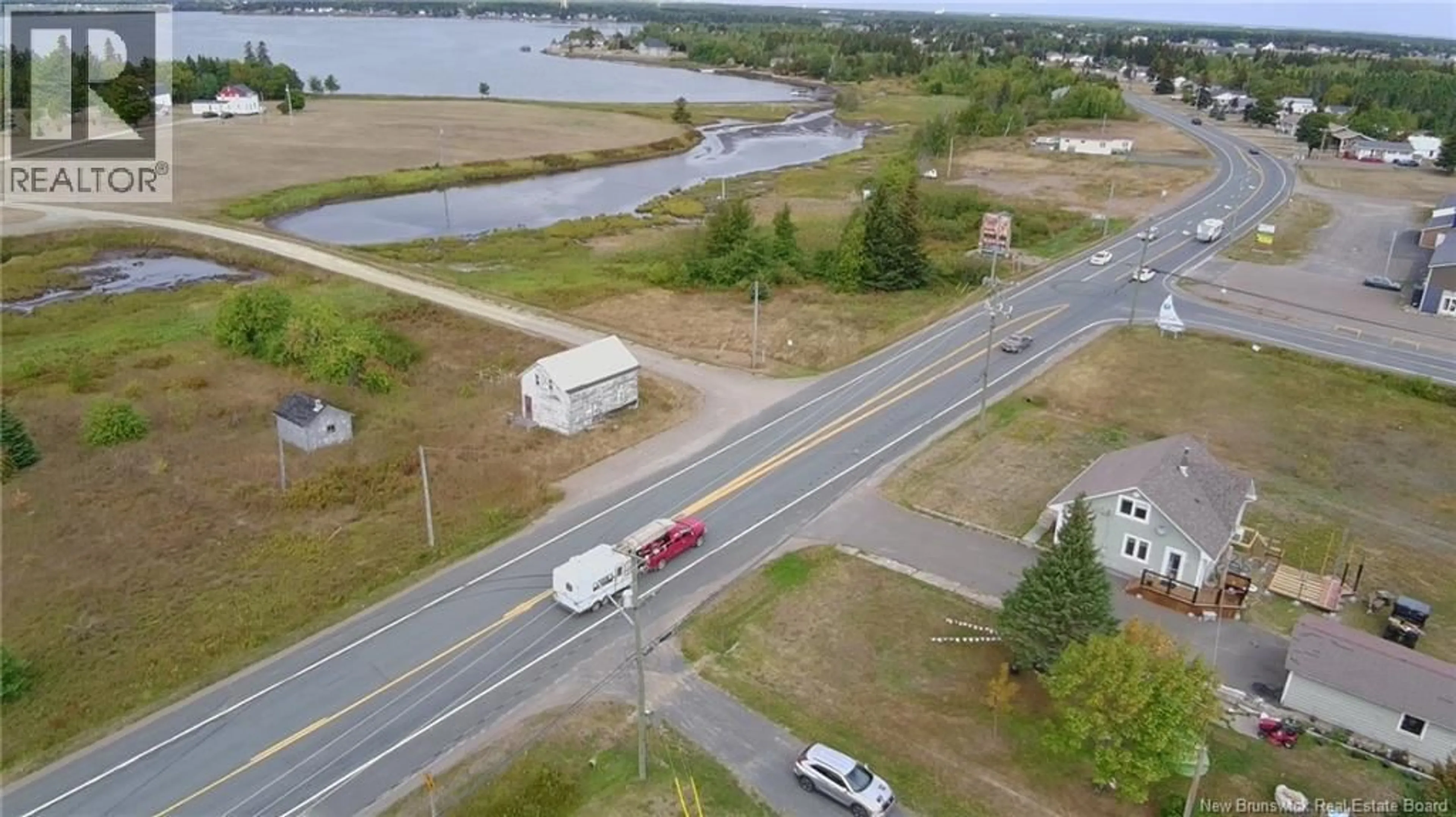 A pic from outside/outdoor area/front of a property/back of a property/a pic from drone, water/lake/river/ocean view for 7247 ROUTE 11, Tracadie New Brunswick E1X3E1