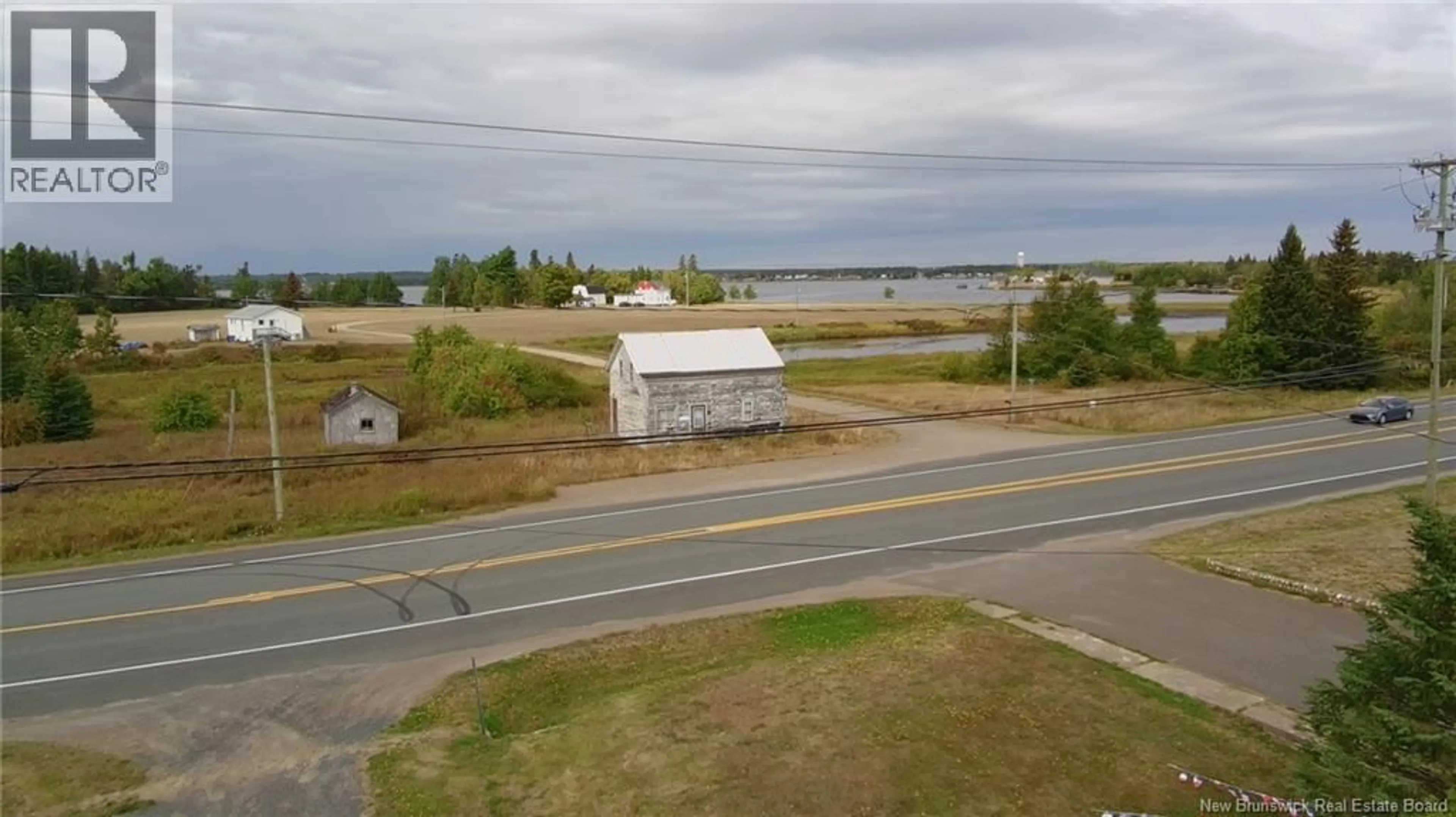 A pic from outside/outdoor area/front of a property/back of a property/a pic from drone, water/lake/river/ocean view for 7247 ROUTE 11, Tracadie New Brunswick E1X3E1