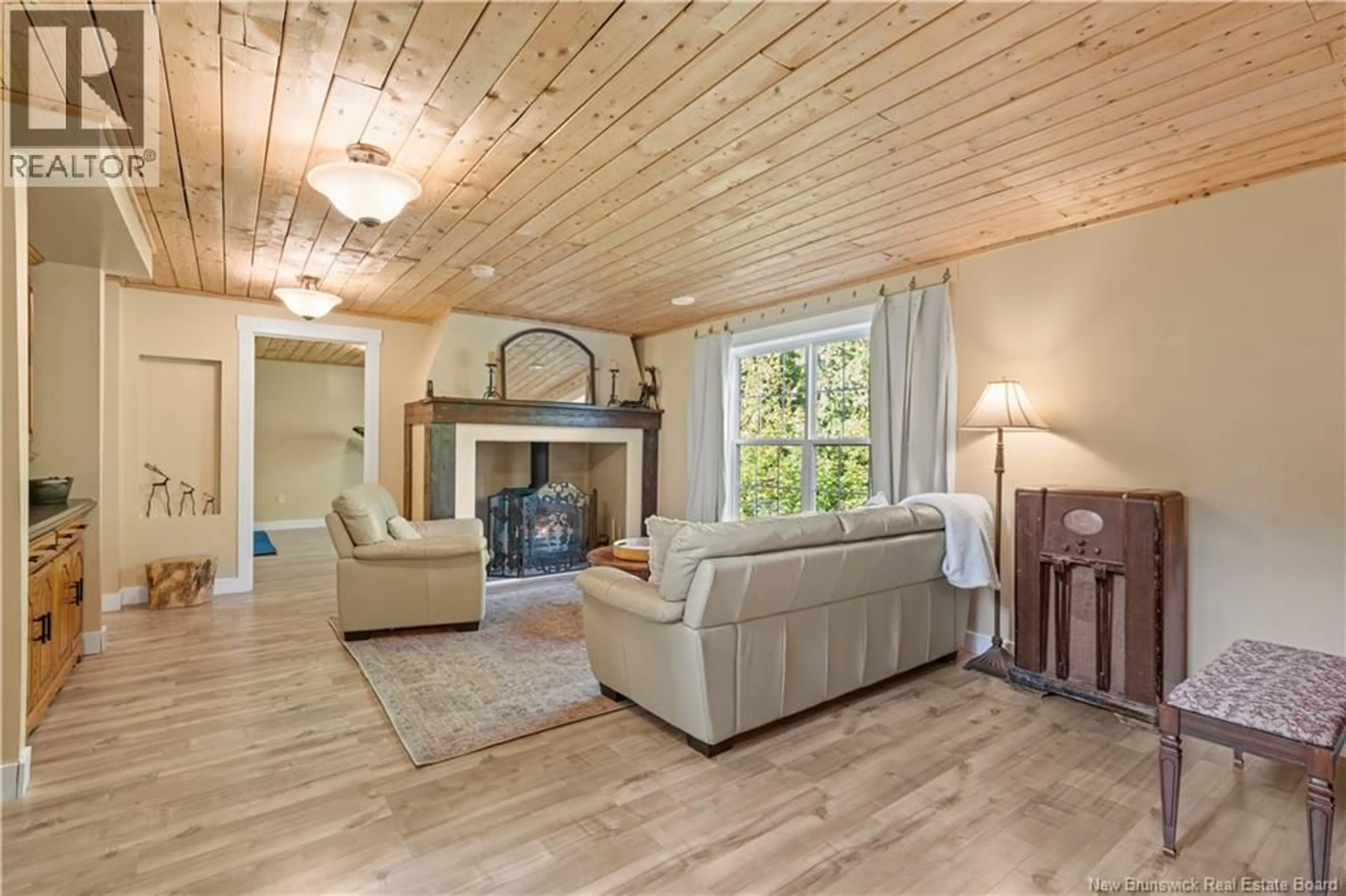 Living room with furniture, wood/laminate floor for 105 MAPLEHURST DRIVE, Richibucto Road New Brunswick E3A0G5