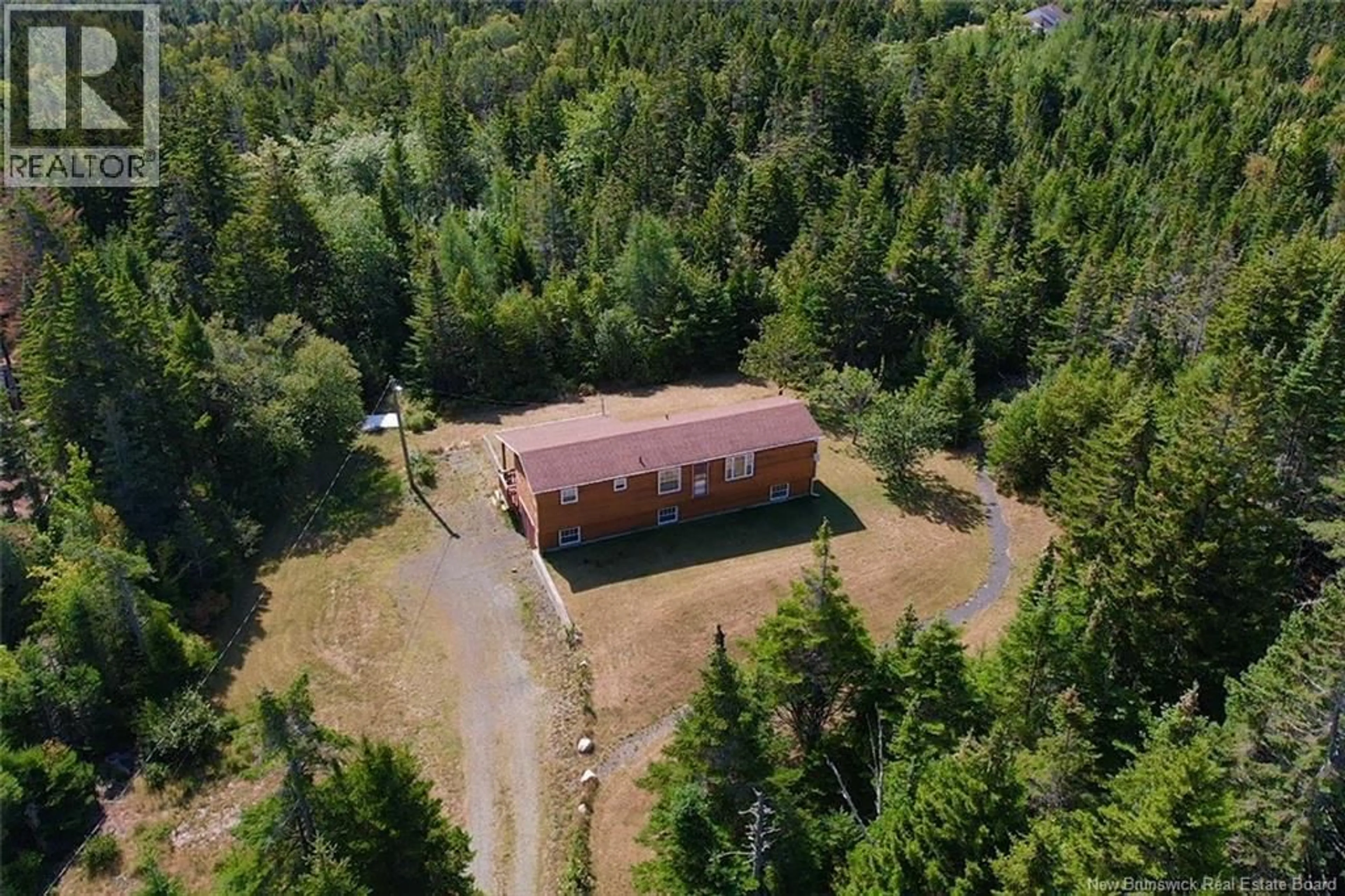 A pic from outside/outdoor area/front of a property/back of a property/a pic from drone, forest/trees view for 57 MILLERS POND ROAD, Grand Manan New Brunswick E5G2G9