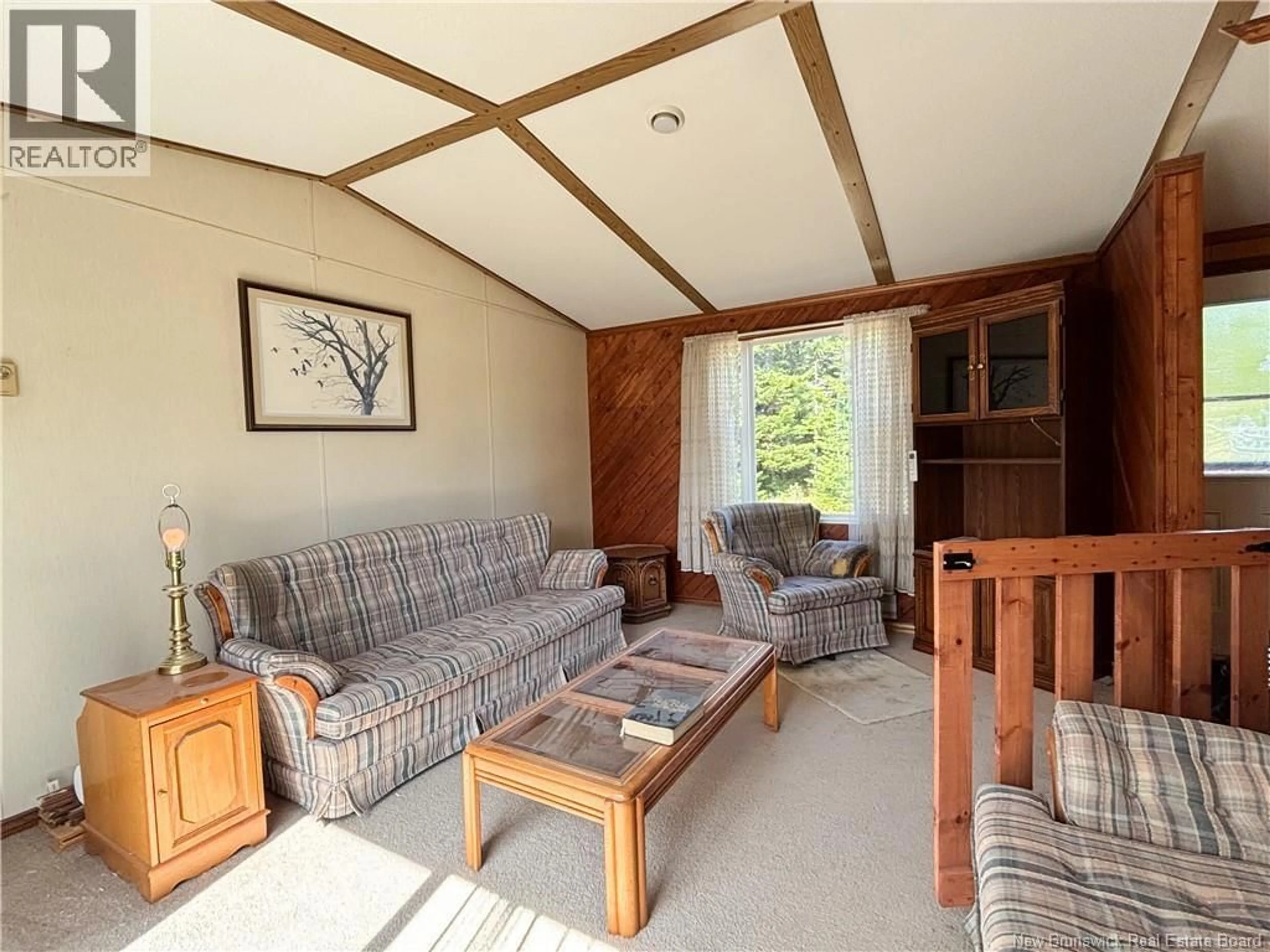 Living room with furniture, wood/laminate floor for 57 MILLERS POND ROAD, Grand Manan New Brunswick E5G2G9
