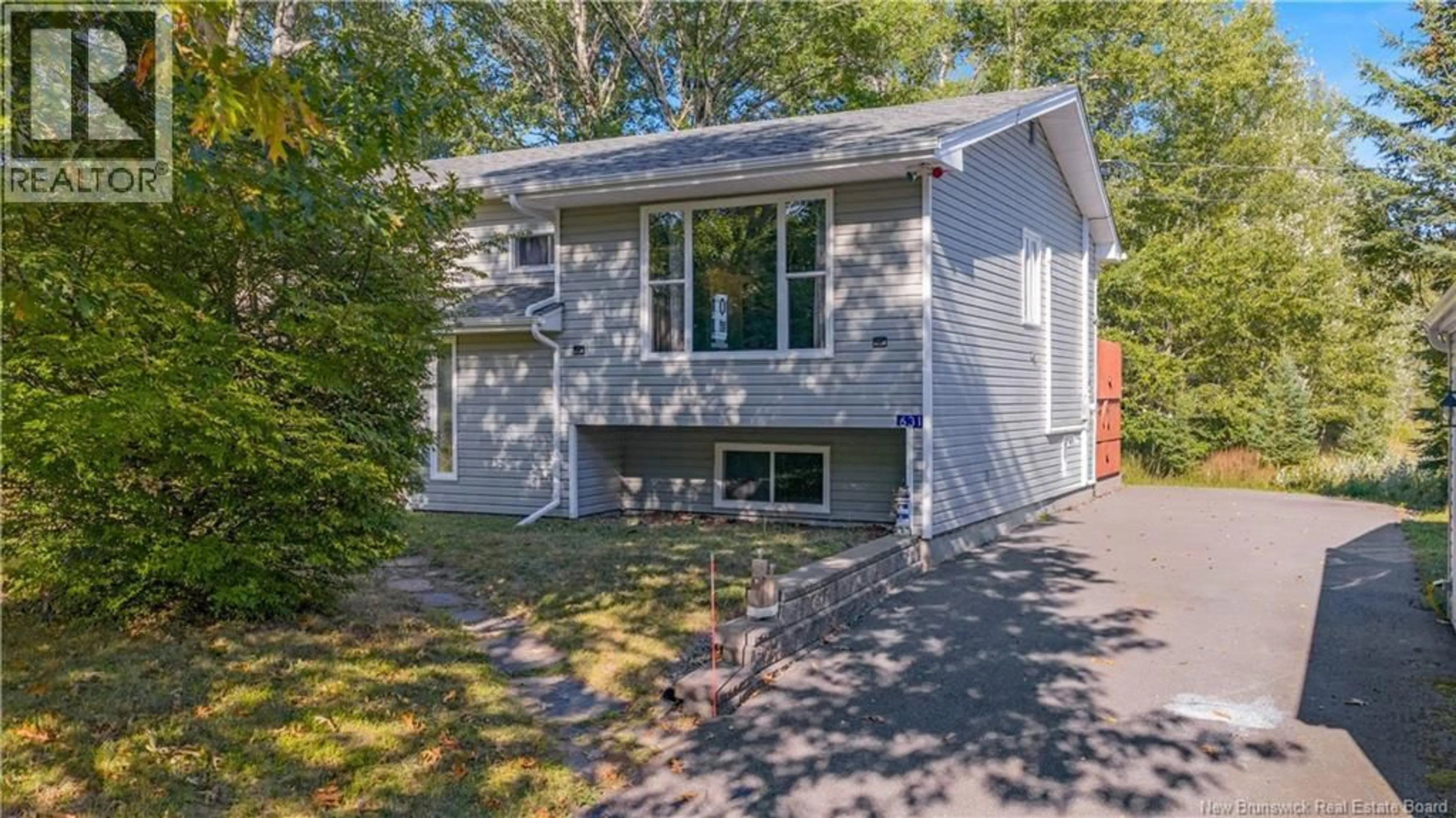 Home with vinyl exterior material, street for 631 KENNEBECASIS RIVER ROAD, Hampton New Brunswick E5N6L8