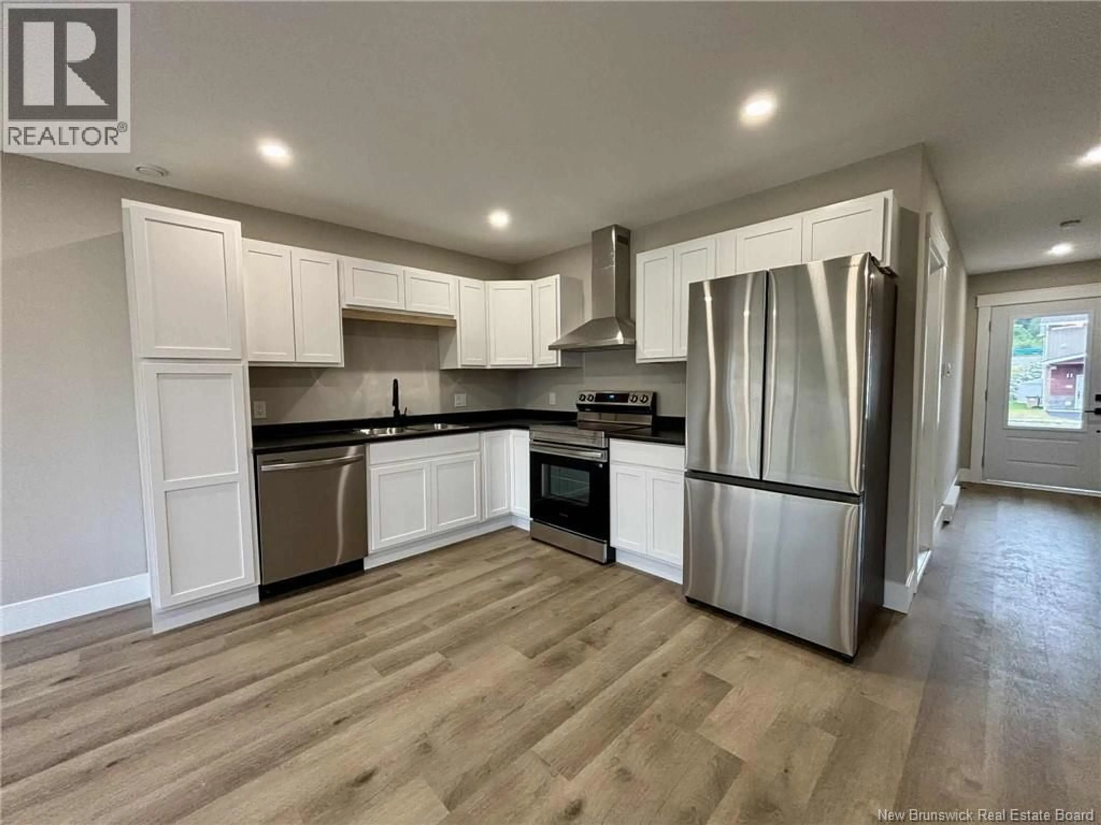 Open concept kitchen, wood/laminate floor for 138 ARLINGTON CRESCENT, Saint John New Brunswick E2K0G4