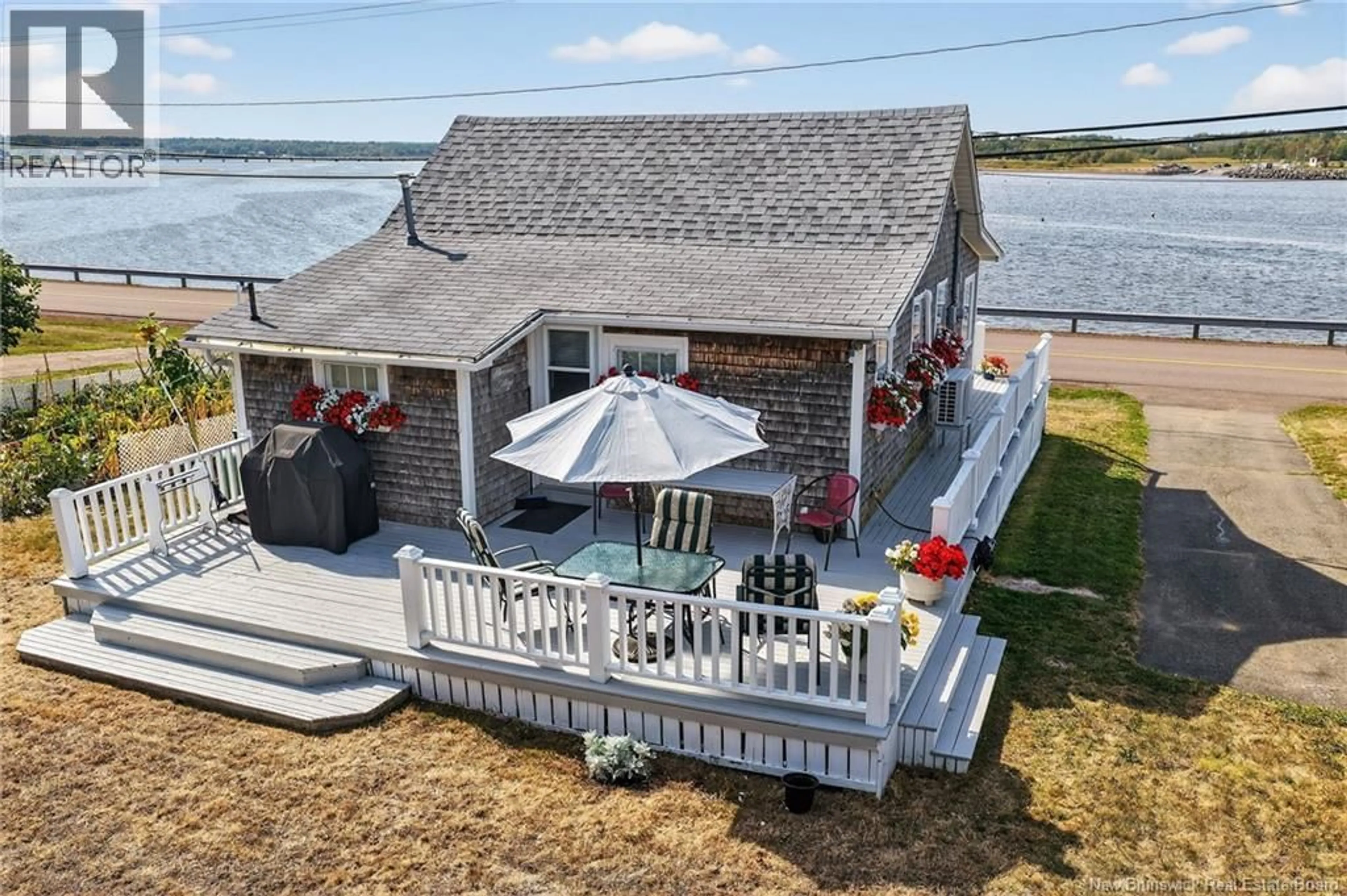A pic from outside/outdoor area/front of a property/back of a property/a pic from drone, water/lake/river/ocean view for 61 COCAGNE SUD ROAD, Cocagne New Brunswick E4R2J7