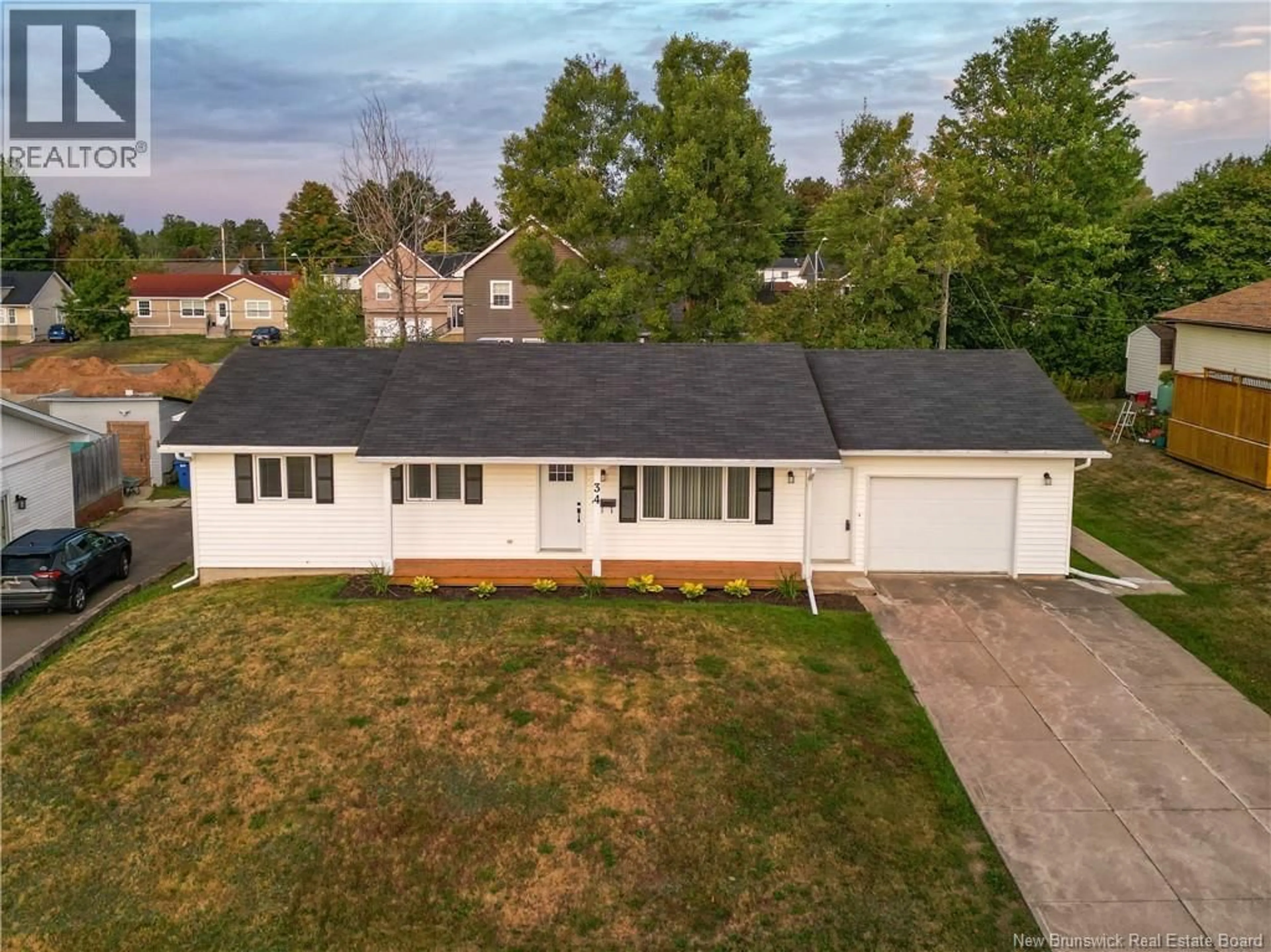 A pic from outside/outdoor area/front of a property/back of a property/a pic from drone, street for 34 MOLLINS CRESCENT, Moncton New Brunswick E1E4L6