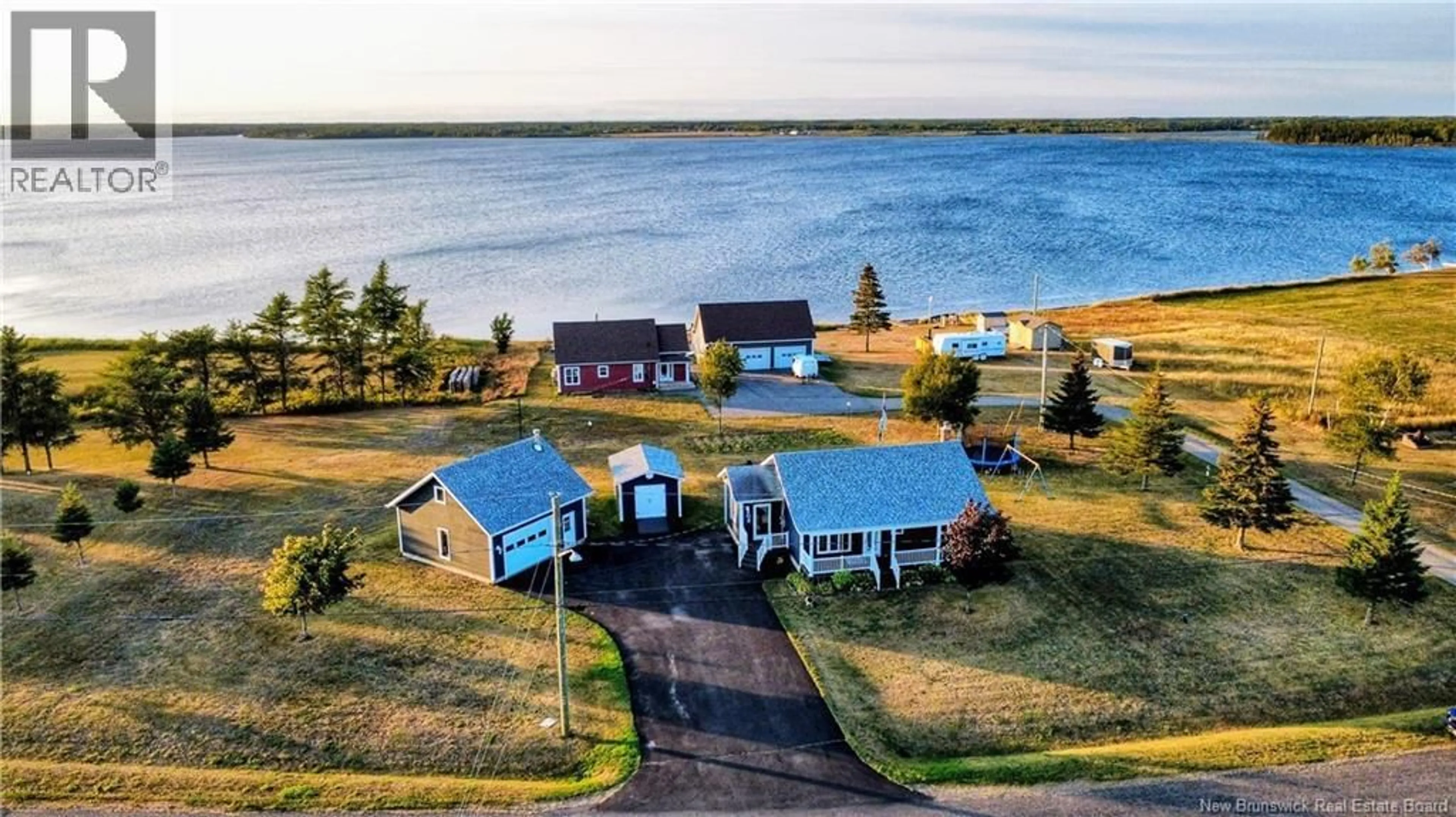A pic from outside/outdoor area/front of a property/back of a property/a pic from drone, water/lake/river/ocean view for 11 RUE DU MOULIN, Inkerman New Brunswick E8P1A7