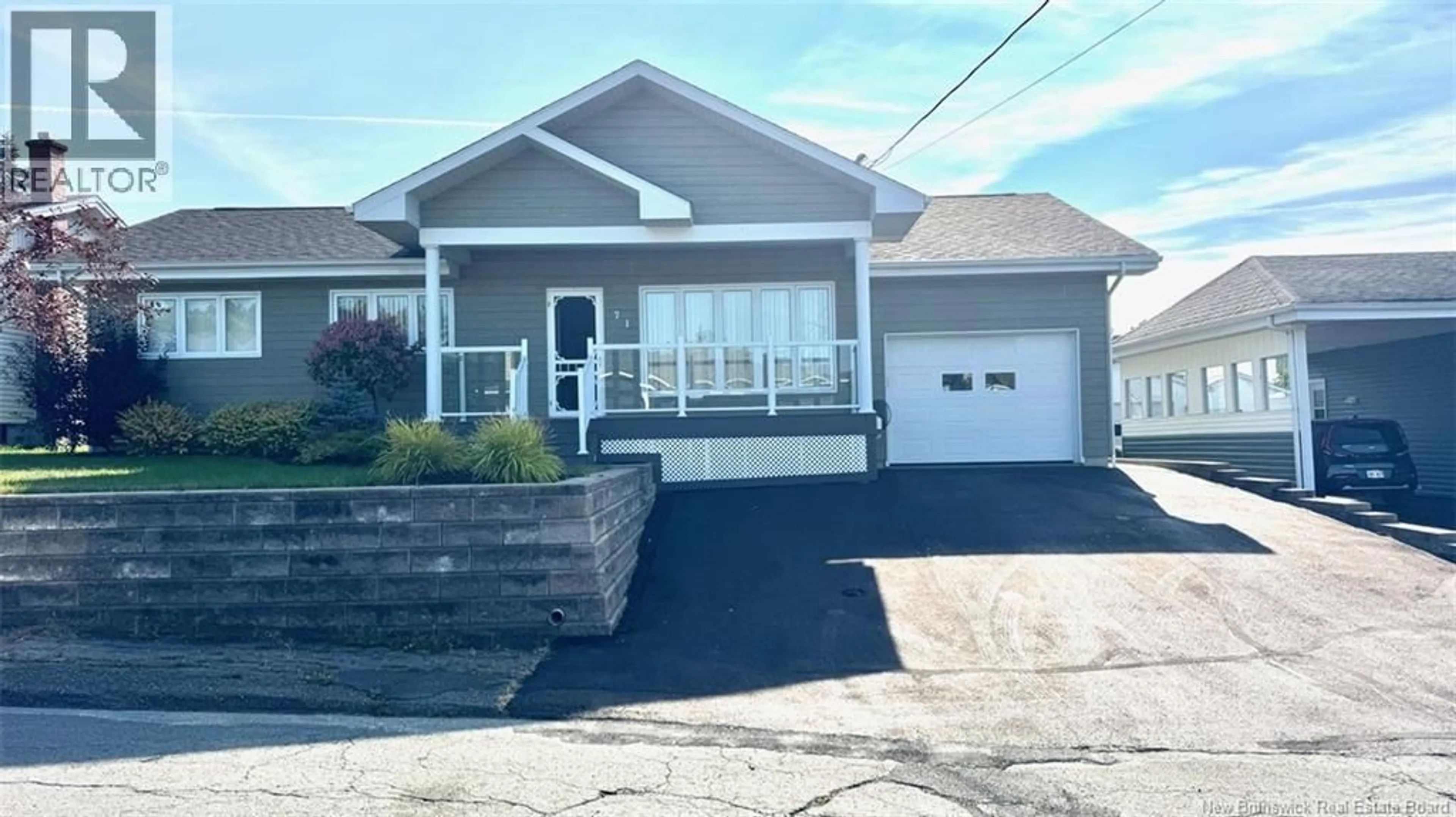 Home with vinyl exterior material, street for 71 48E AVENUE, Edmundston New Brunswick E3V3E1