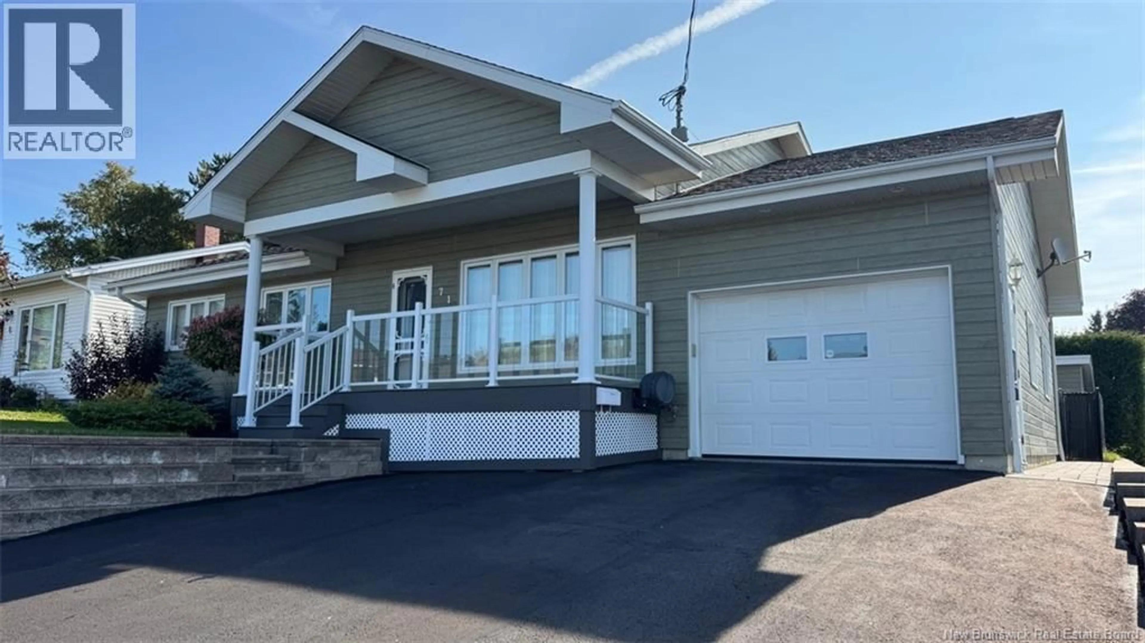 Home with vinyl exterior material, street for 71 48E AVENUE, Edmundston New Brunswick E3V3E1