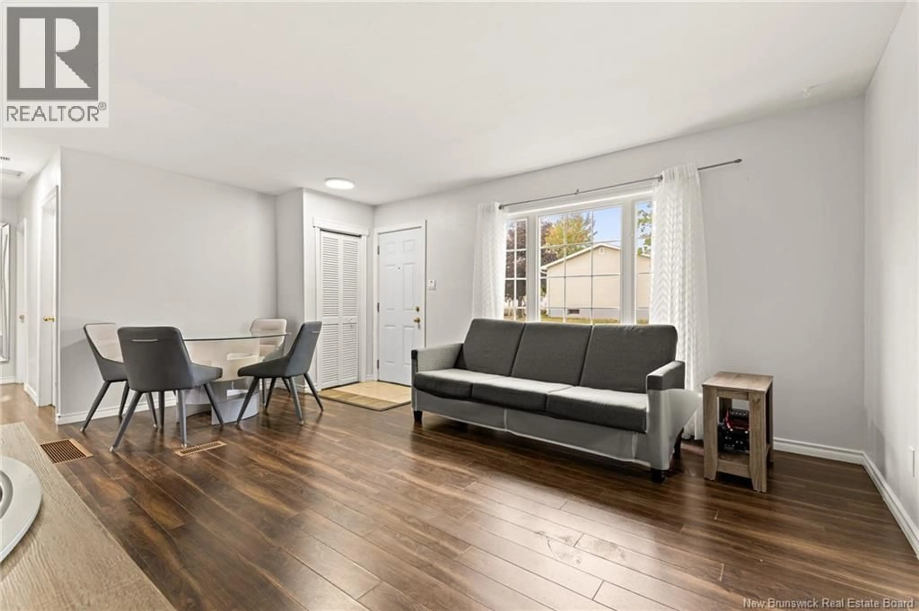 Living room with furniture, wood/laminate floor for 5 WILDWOOD, Moncton New Brunswick E1E2M4