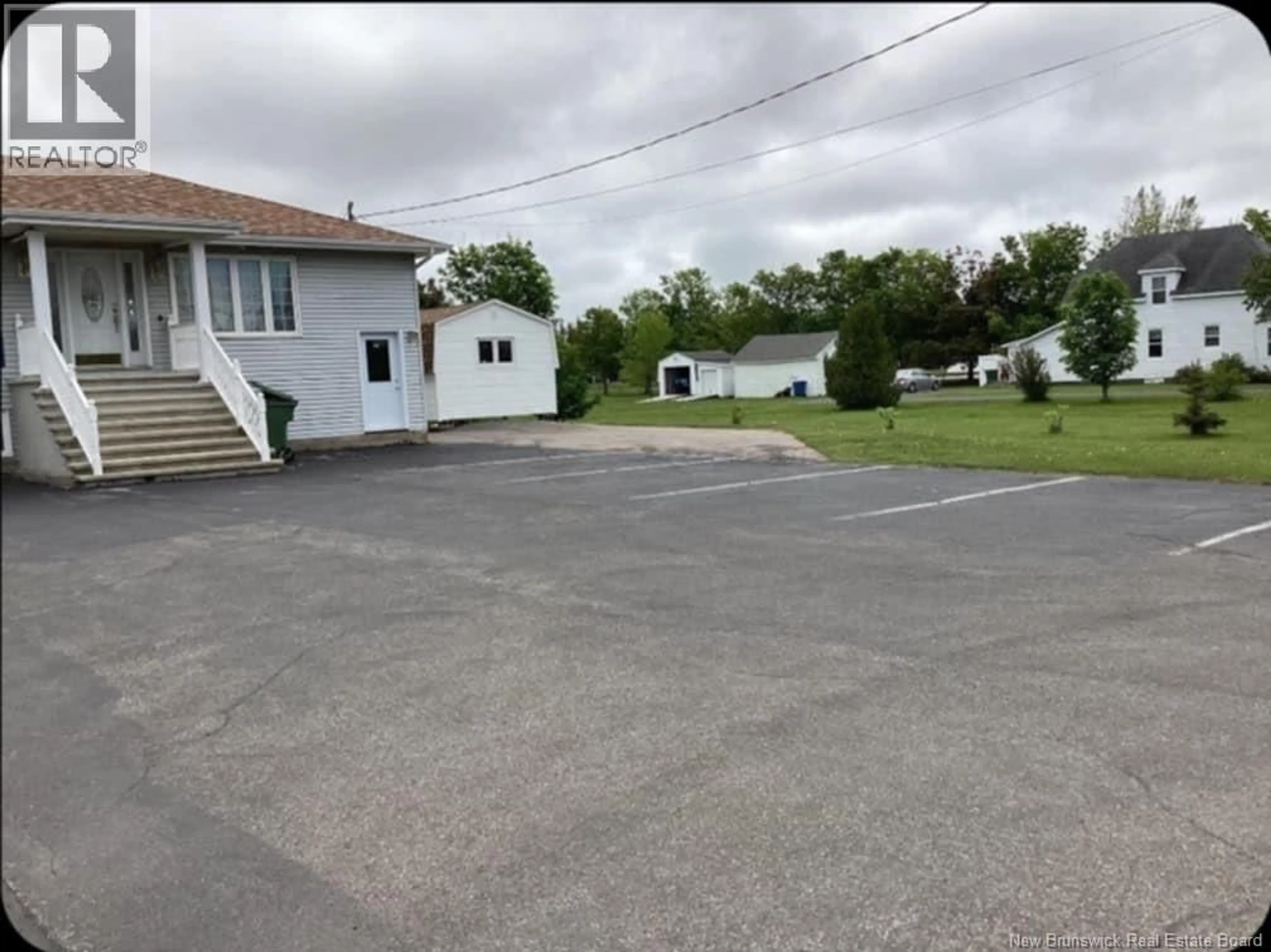 A pic from outside/outdoor area/front of a property/back of a property/a pic from drone, street for 214 IER ROAD, Shippagan New Brunswick E8S1T2