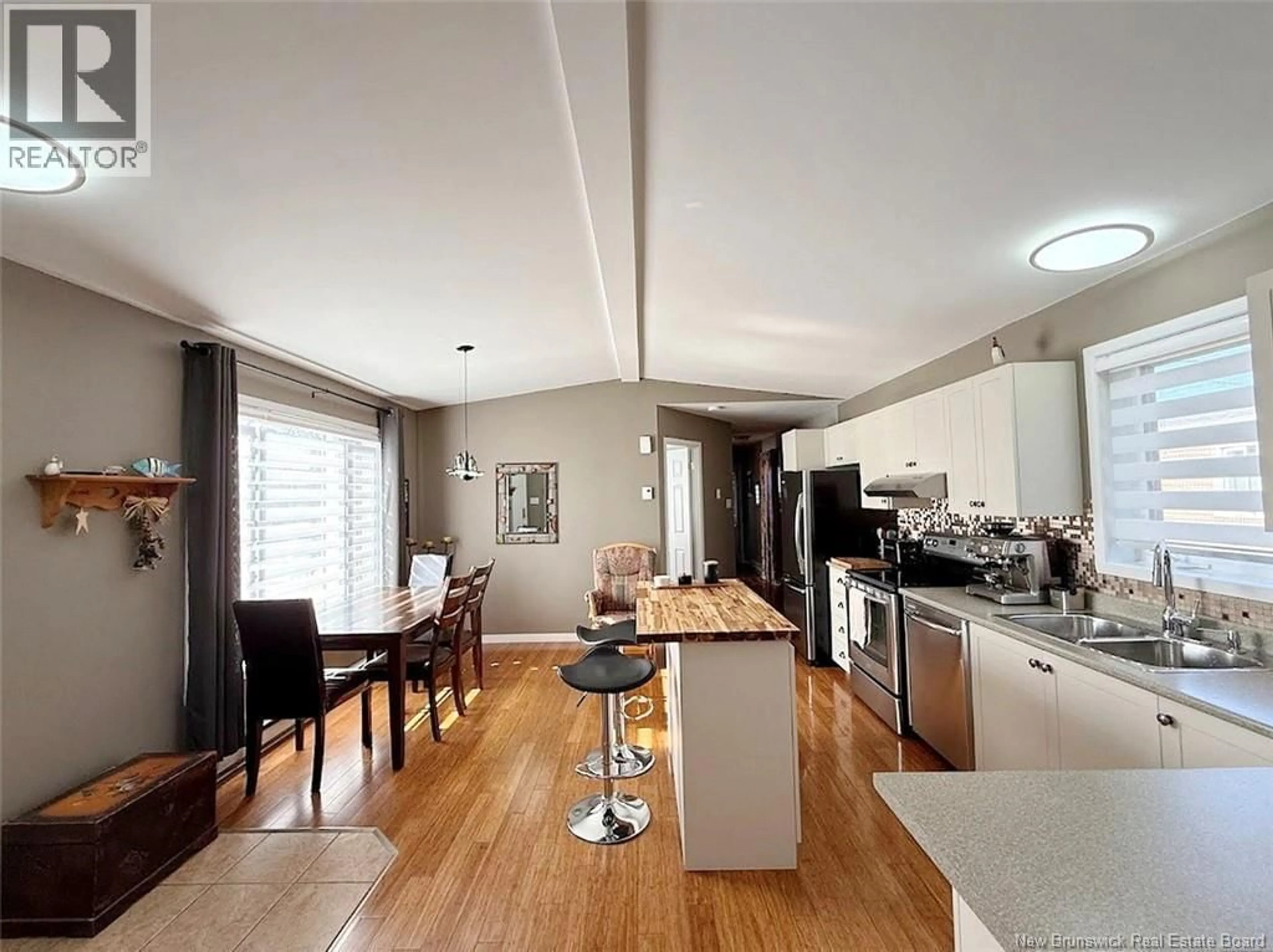 Open concept kitchen, wood/laminate floor for 4 LAVALLÉE STREET, Saint-Jacques New Brunswick E7B1T3