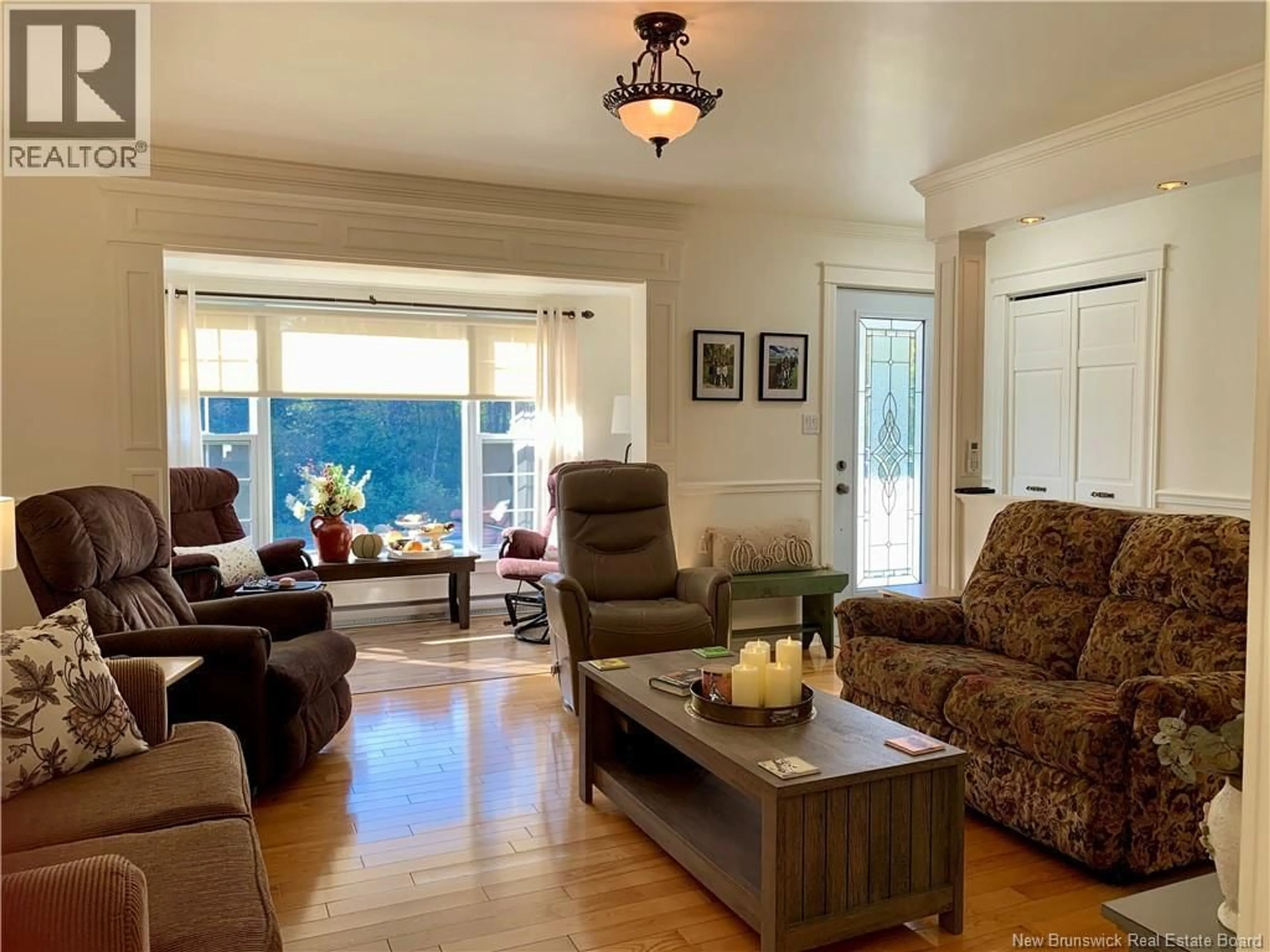 Living room with furniture, wood/laminate floor for 177 AVE DES PIONNIERS AVE, Balmoral New Brunswick E8E1B1