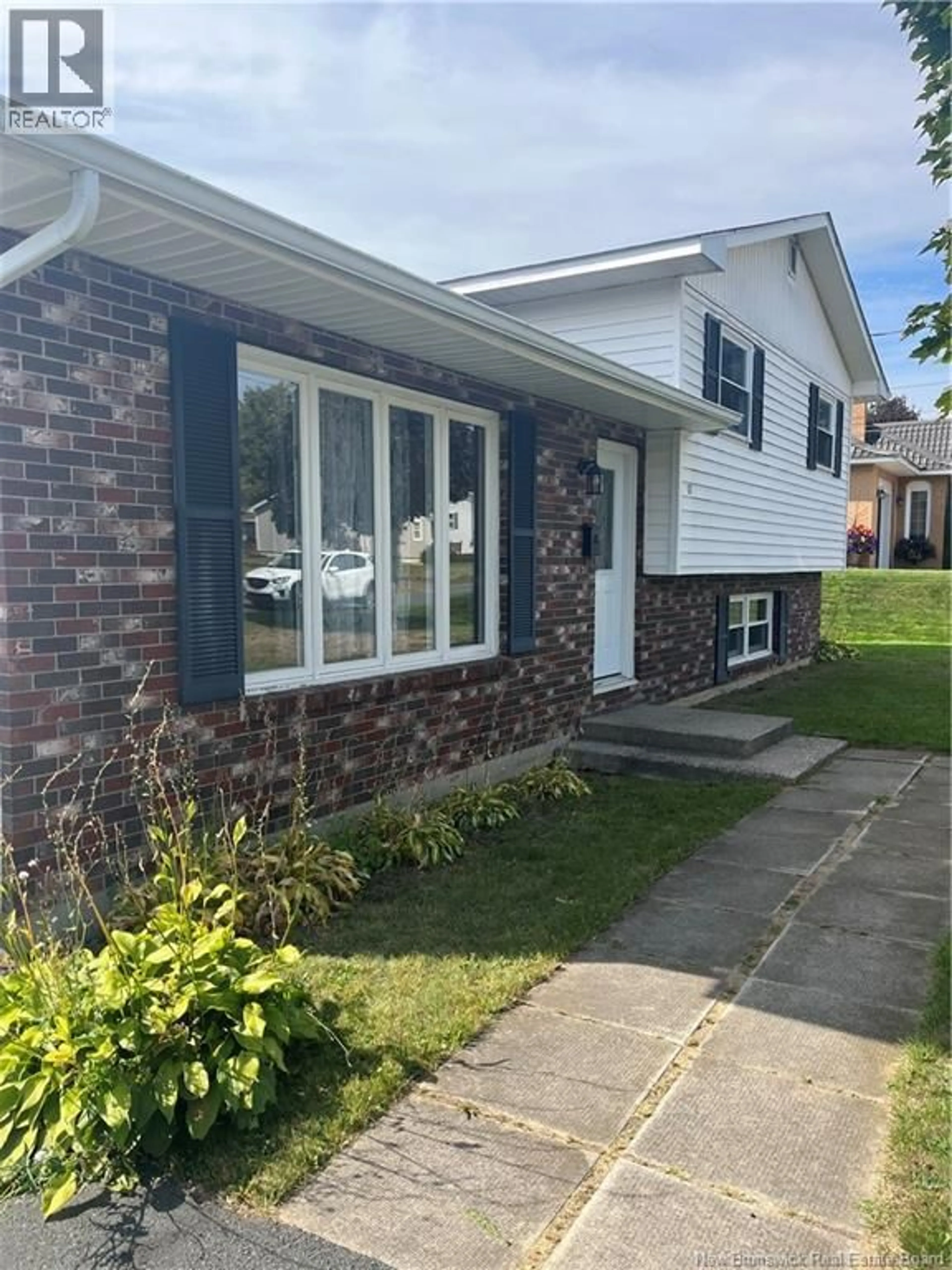 Home with vinyl exterior material, street for 17 ADAMS AVENUE, Miramichi New Brunswick E1V3Y6