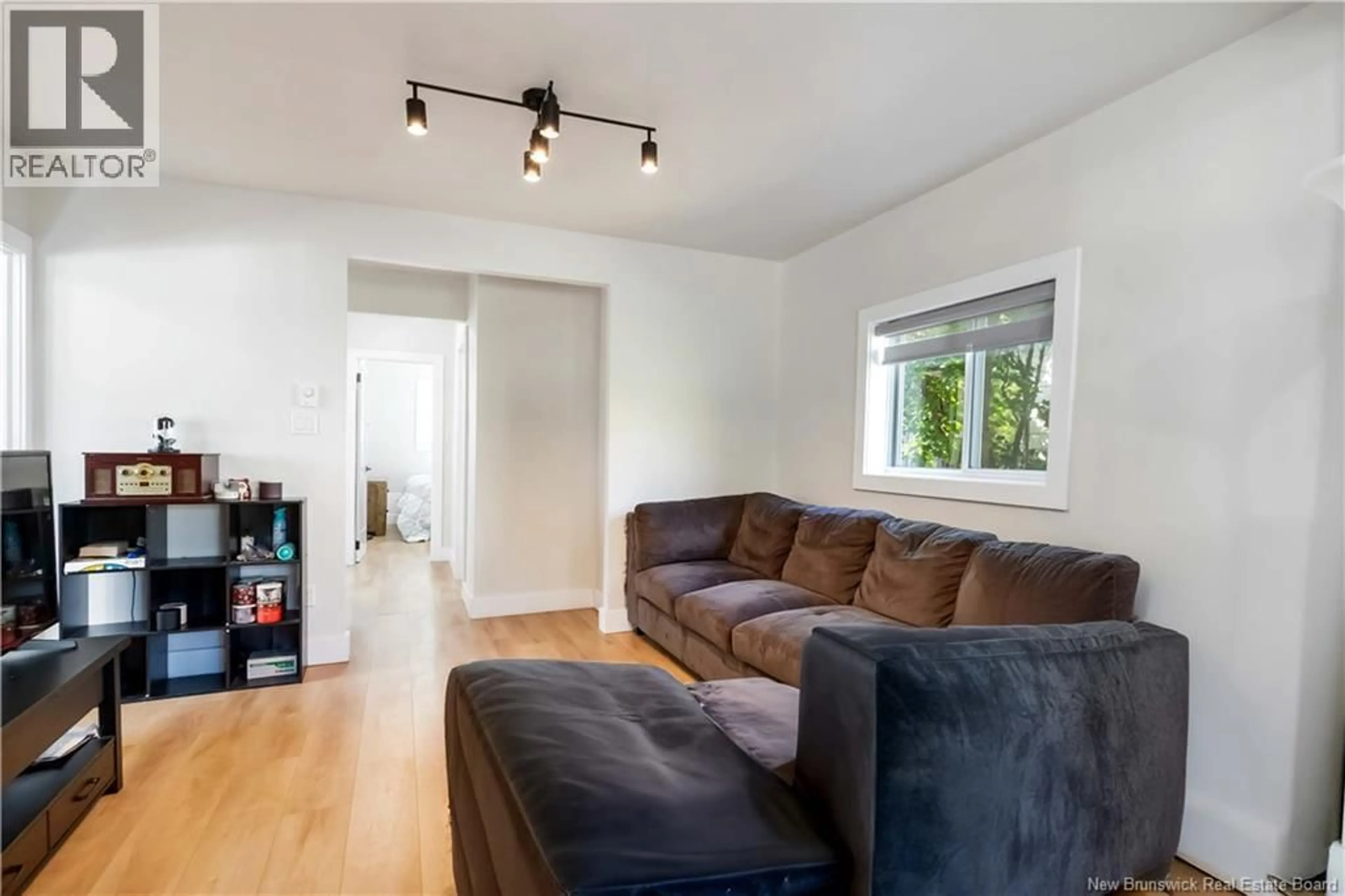 Living room with furniture, wood/laminate floor for 48 EIGHTH STREET, Moncton New Brunswick E1E3E9