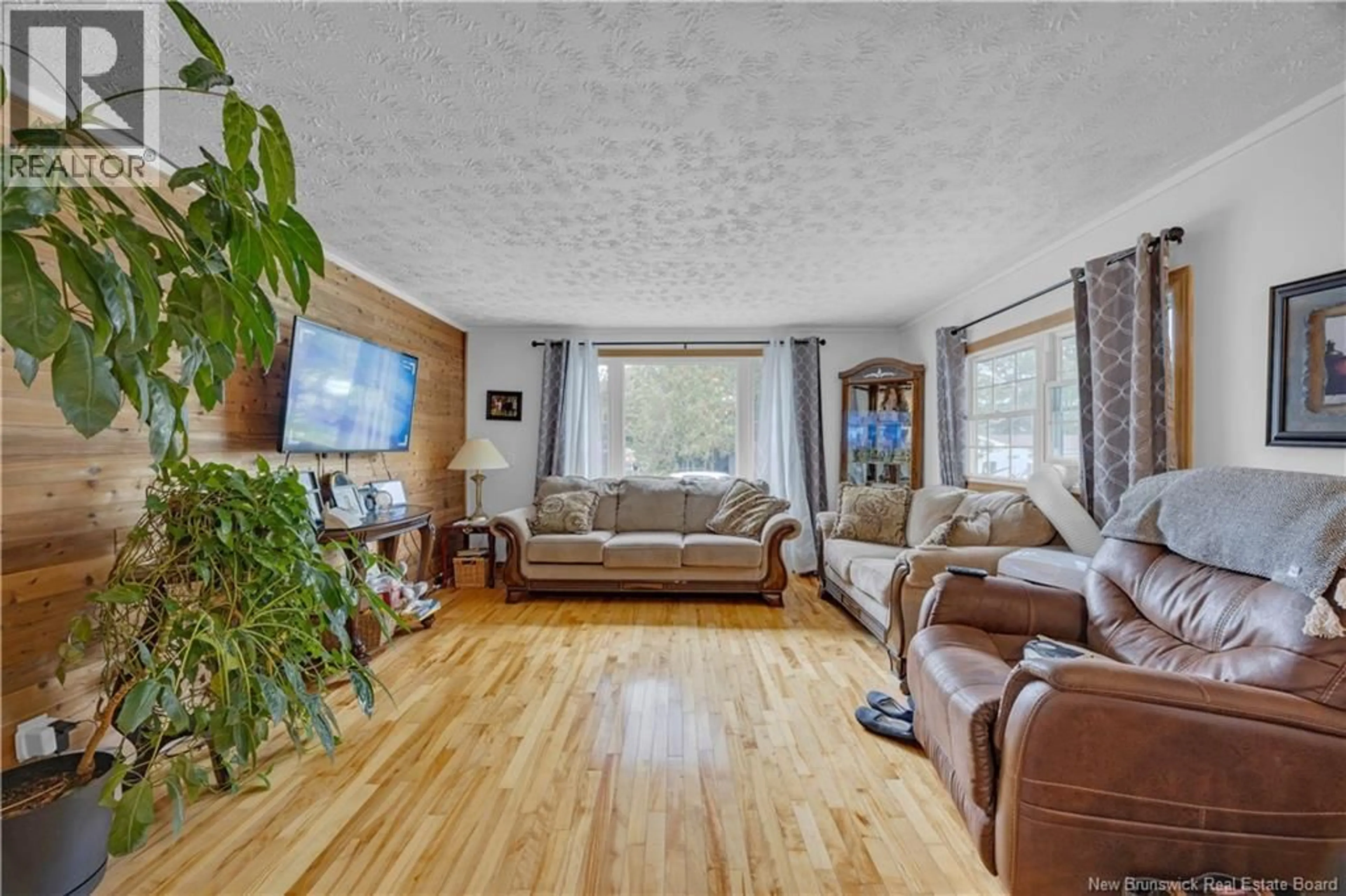 Living room with furniture, wood/laminate floor for 43 WALNUT LANE, Quispamsis New Brunswick E2G1X2