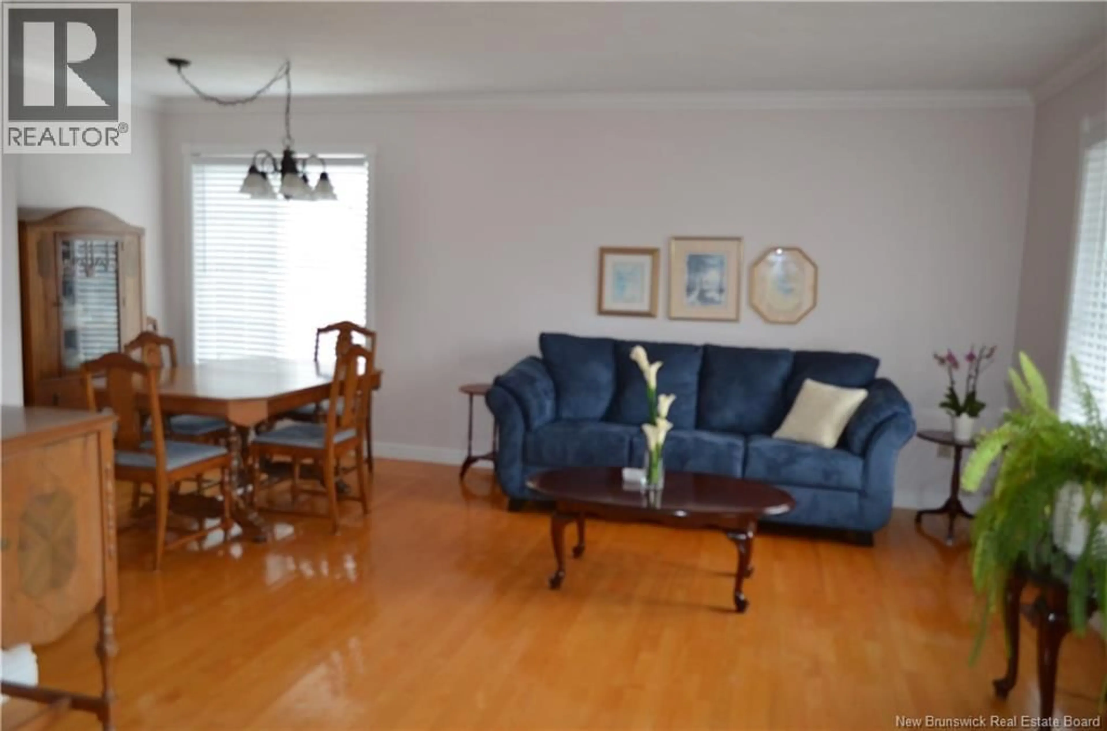 Living room with furniture, wood/laminate floor for 239 ORLEANS STREET, Dieppe New Brunswick E1A1W8
