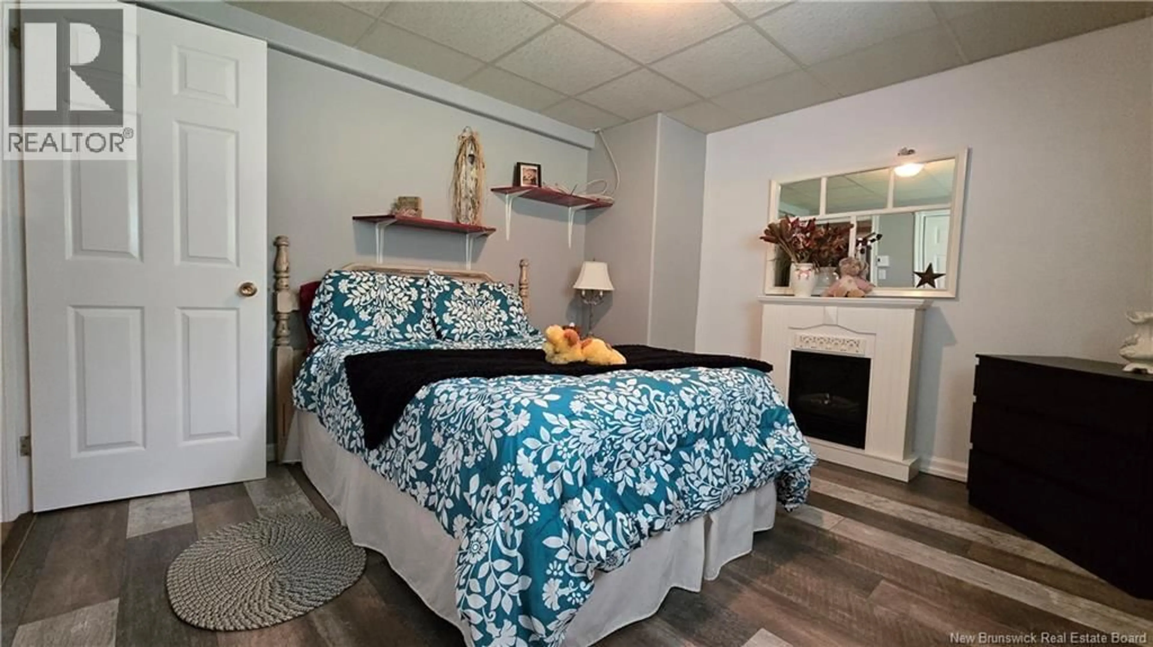Bedroom with bed, wood/laminate floor for 2 CHOUINARD STREET, Eel River Crossing New Brunswick E8E1P3