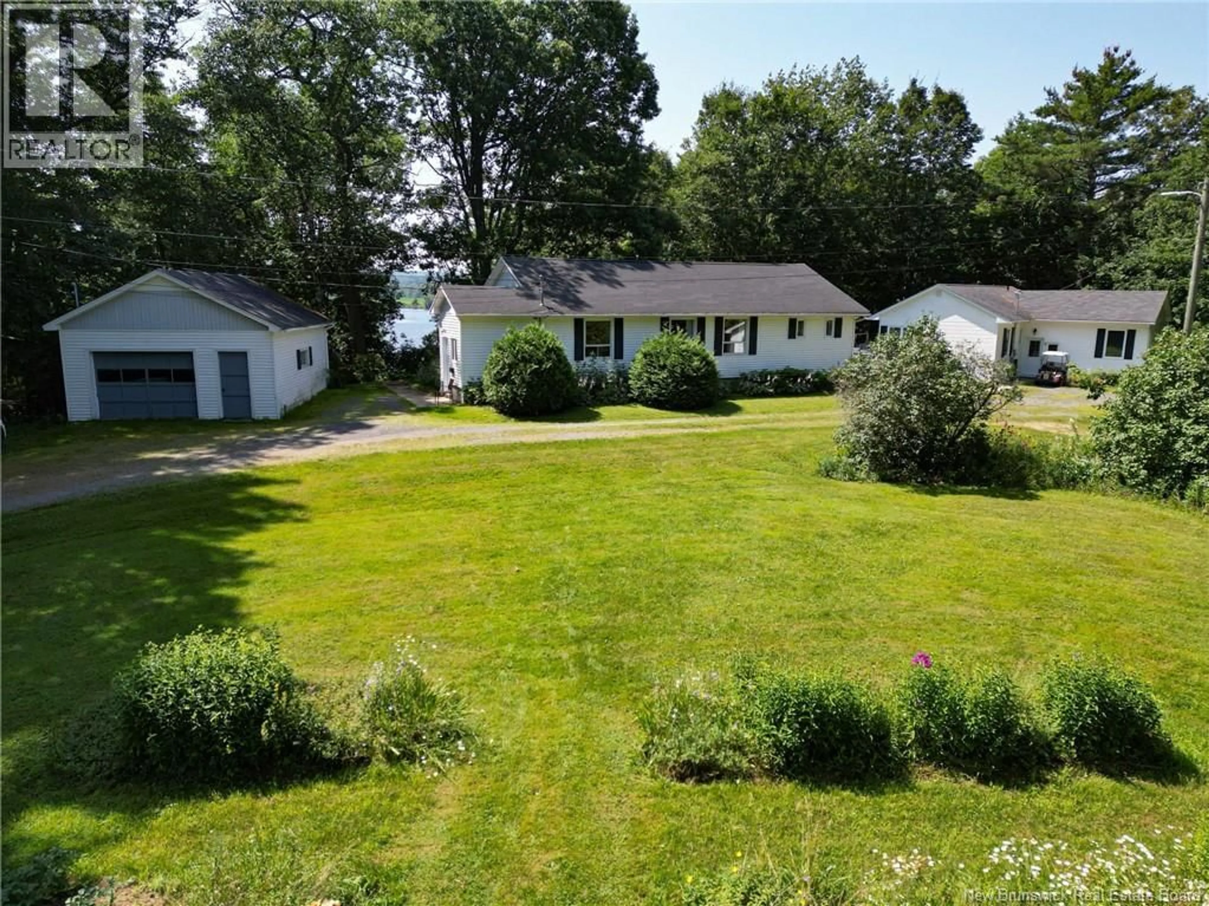A pic from outside/outdoor area/front of a property/back of a property/a pic from drone, unknown for 20 NICHOLSON LANE, Douglas New Brunswick E3G7M1