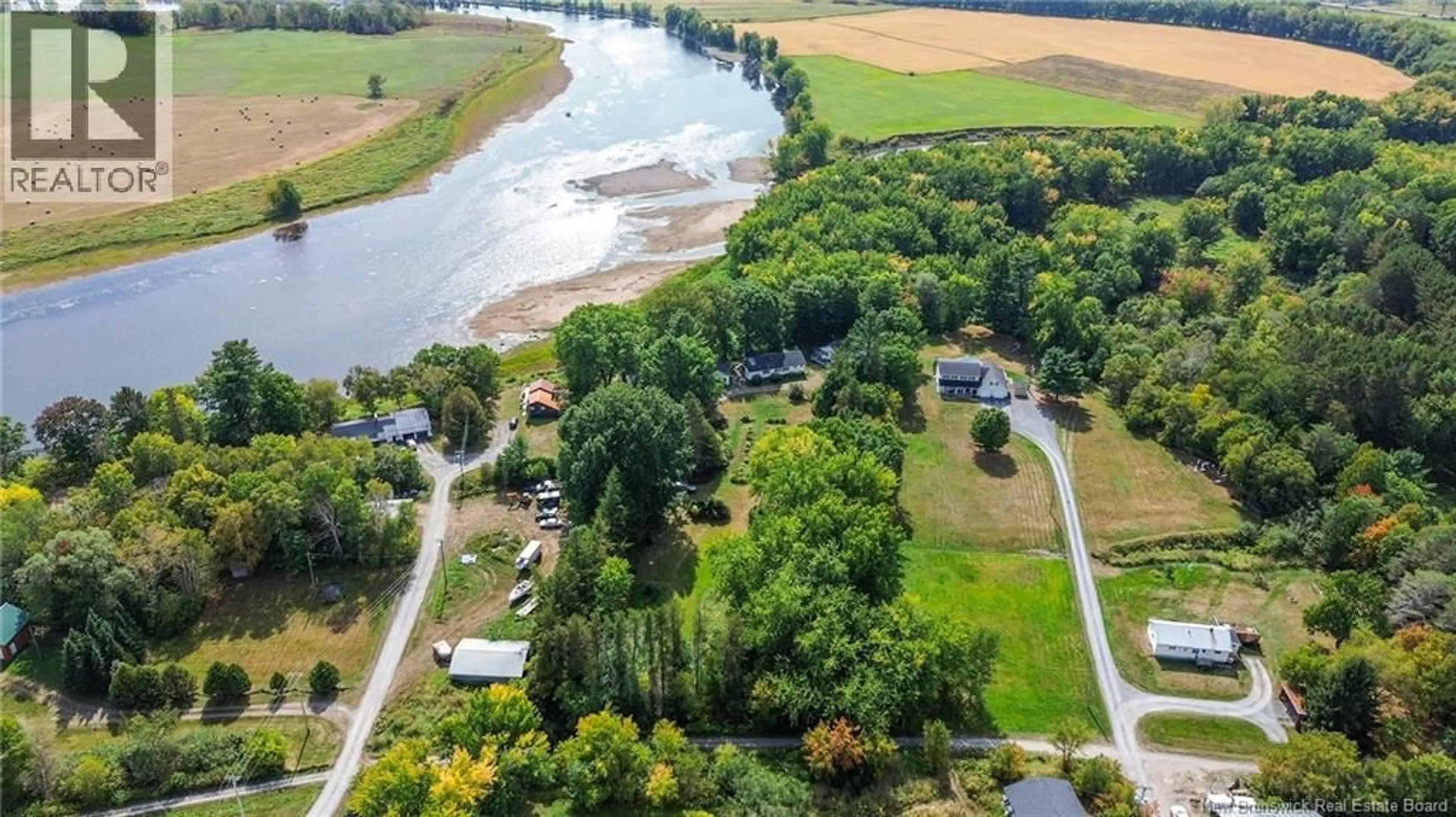 A pic from outside/outdoor area/front of a property/back of a property/a pic from drone, water/lake/river/ocean view for 20 NICHOLSON LANE, Douglas New Brunswick E3G7M1