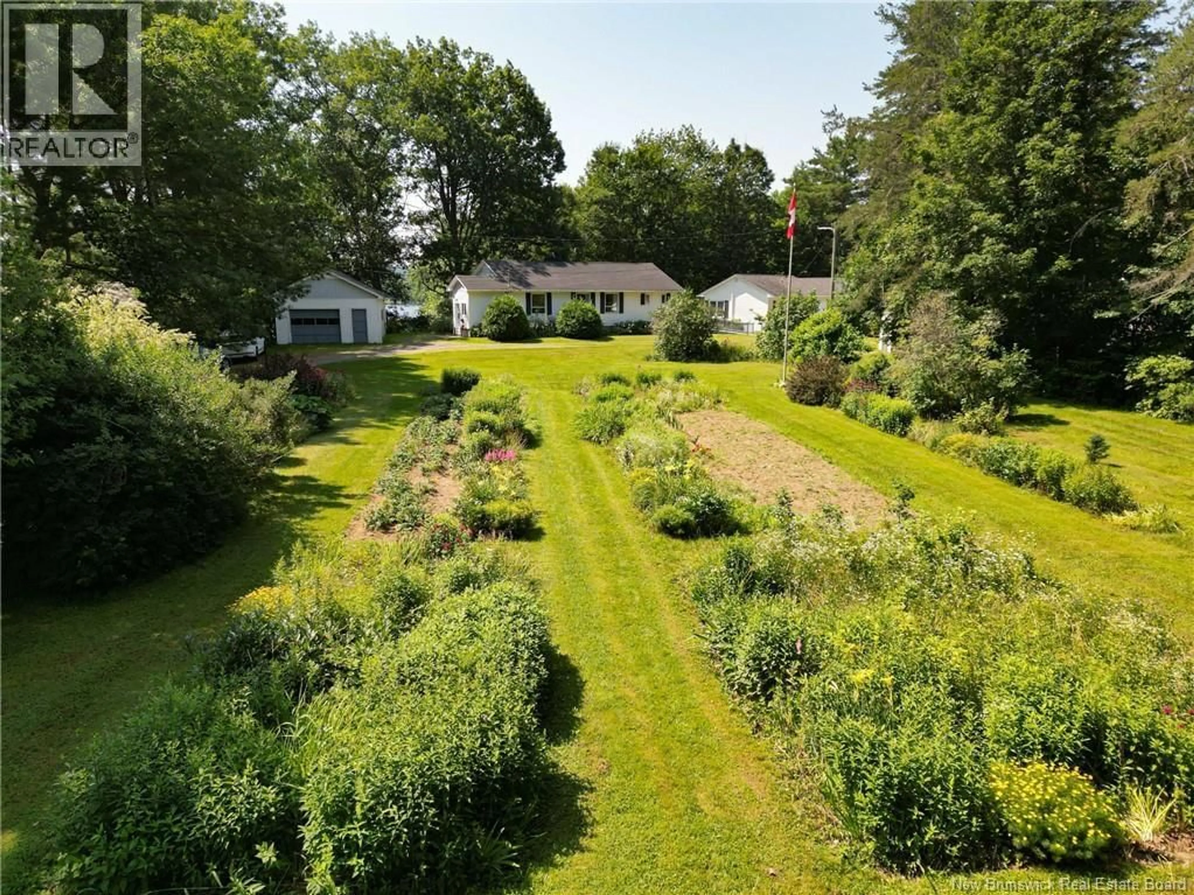 A pic from outside/outdoor area/front of a property/back of a property/a pic from drone, street for 20 NICHOLSON LANE, Douglas New Brunswick E3G7M1