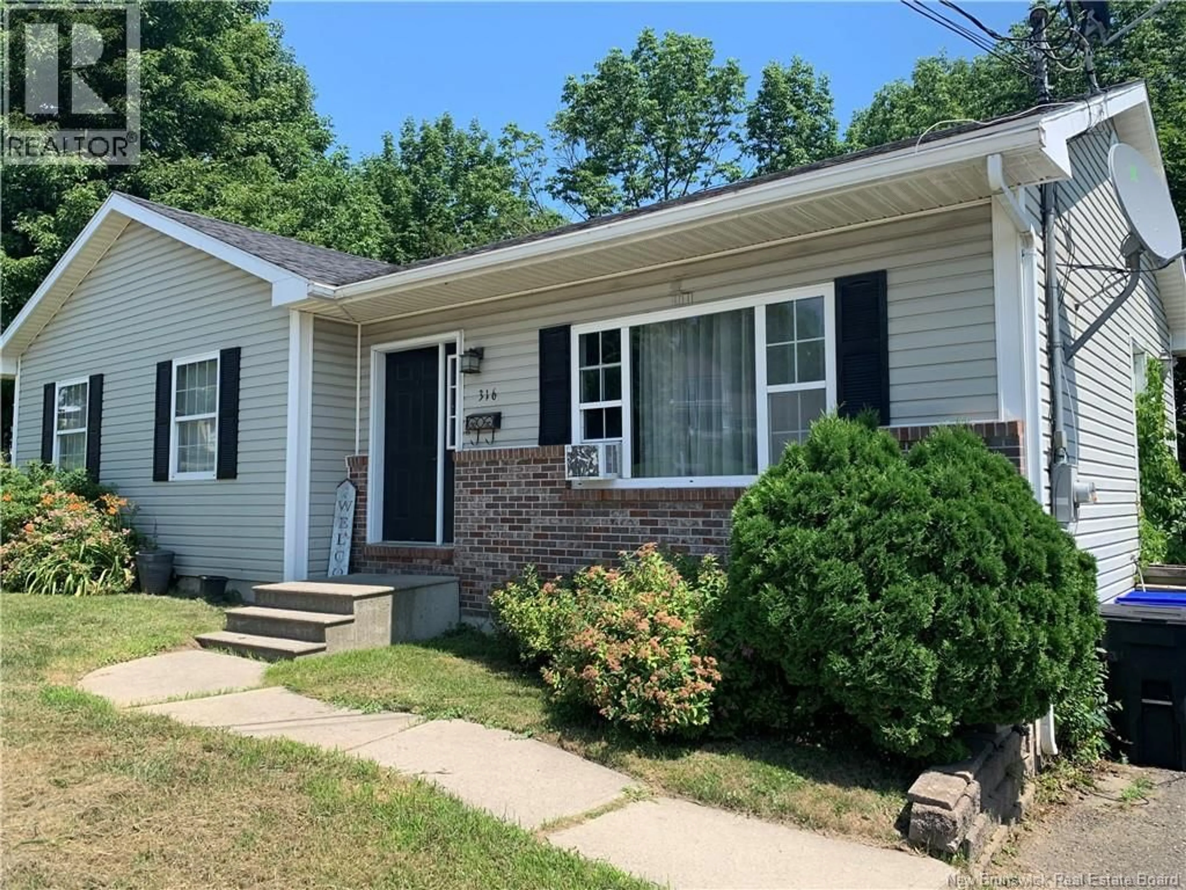 Home with vinyl exterior material, street for 316 MILLTOWN BOULEVARD, St. Stephen New Brunswick E3L1H9