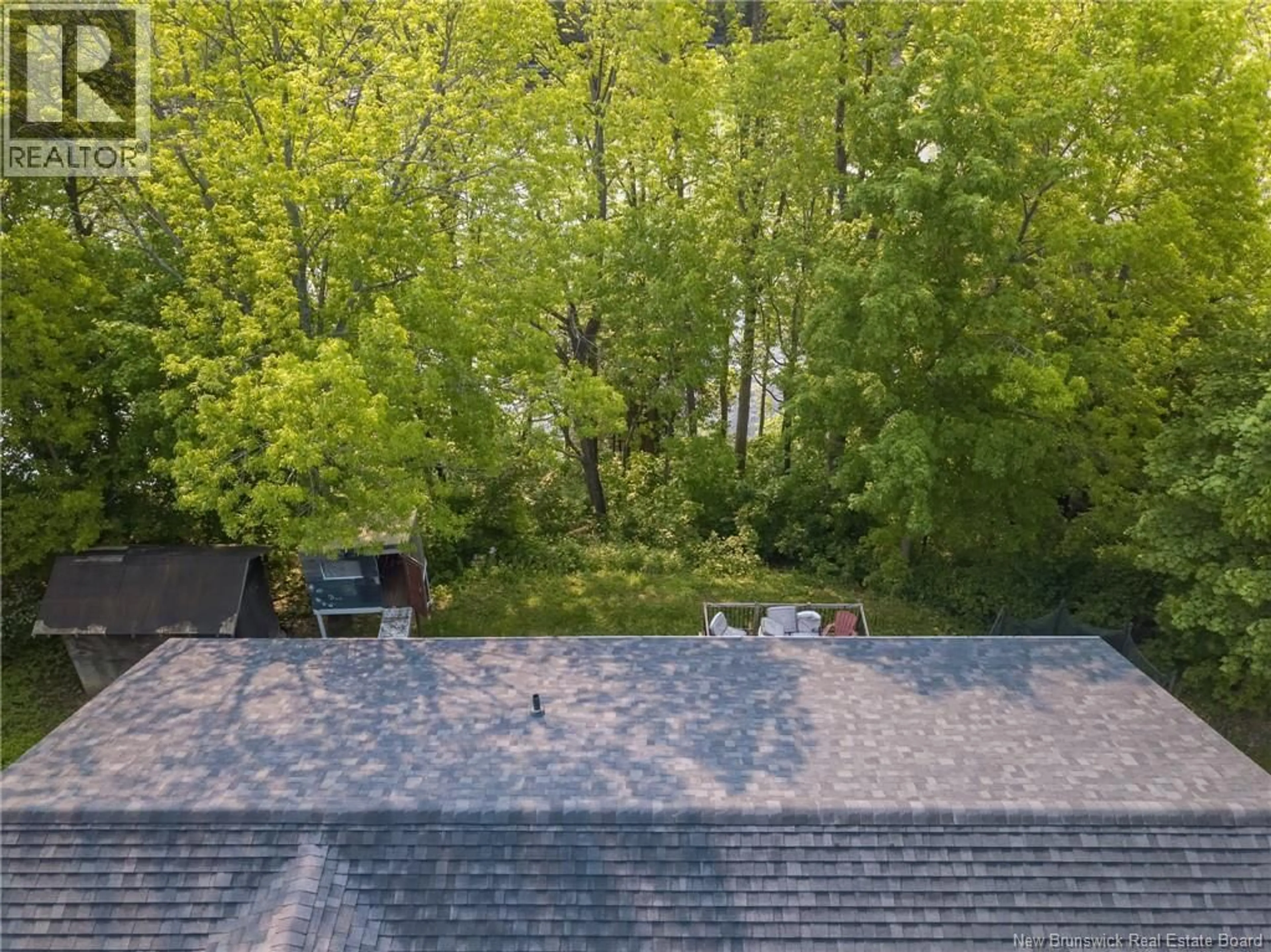 A pic from outside/outdoor area/front of a property/back of a property/a pic from drone, forest/trees view for 316 MILLTOWN BOULEVARD, St. Stephen New Brunswick E3L1H9