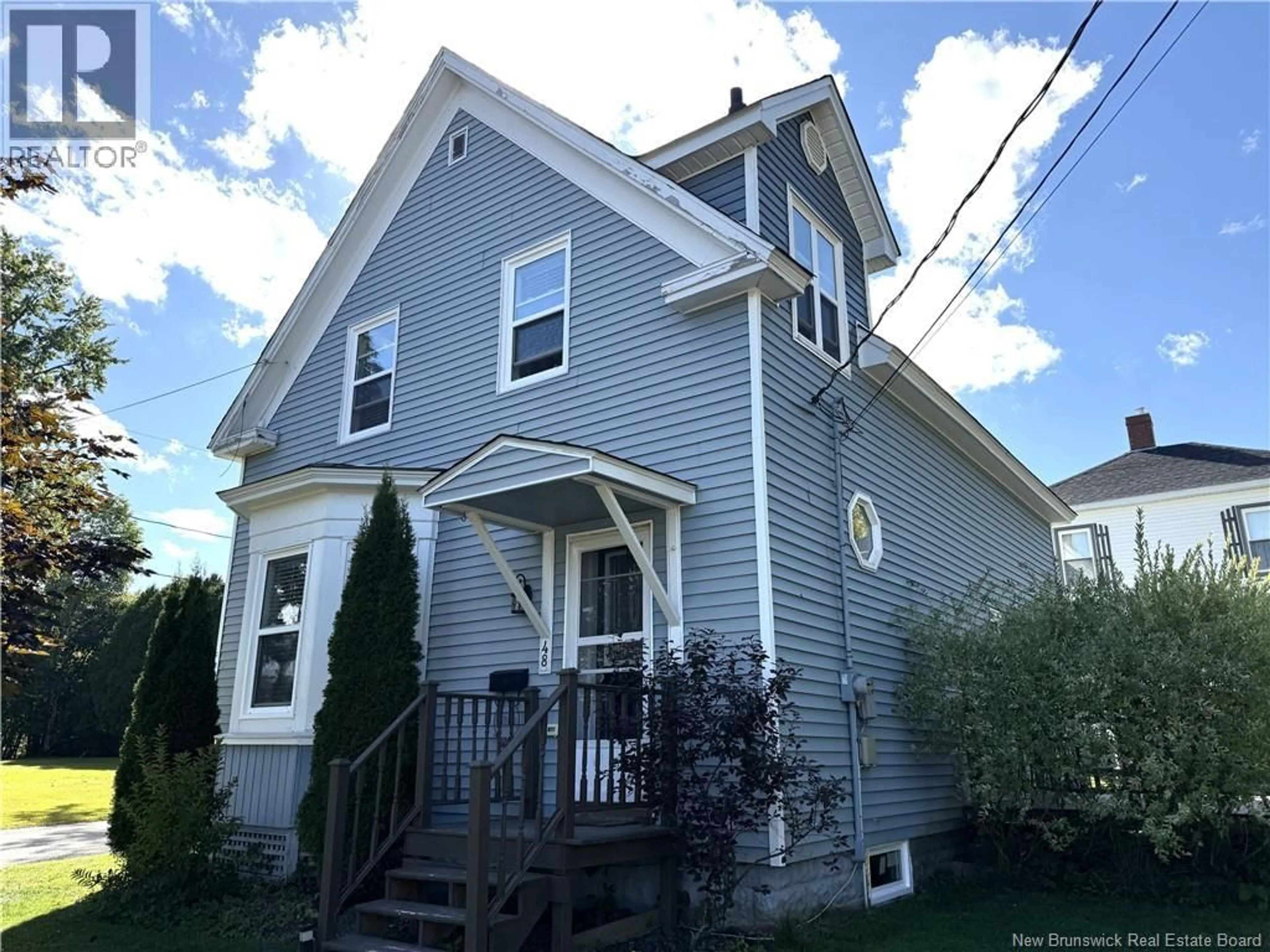 Home with vinyl exterior material, street for 48 MAIN STREET, St. Stephen New Brunswick E3L1Z6