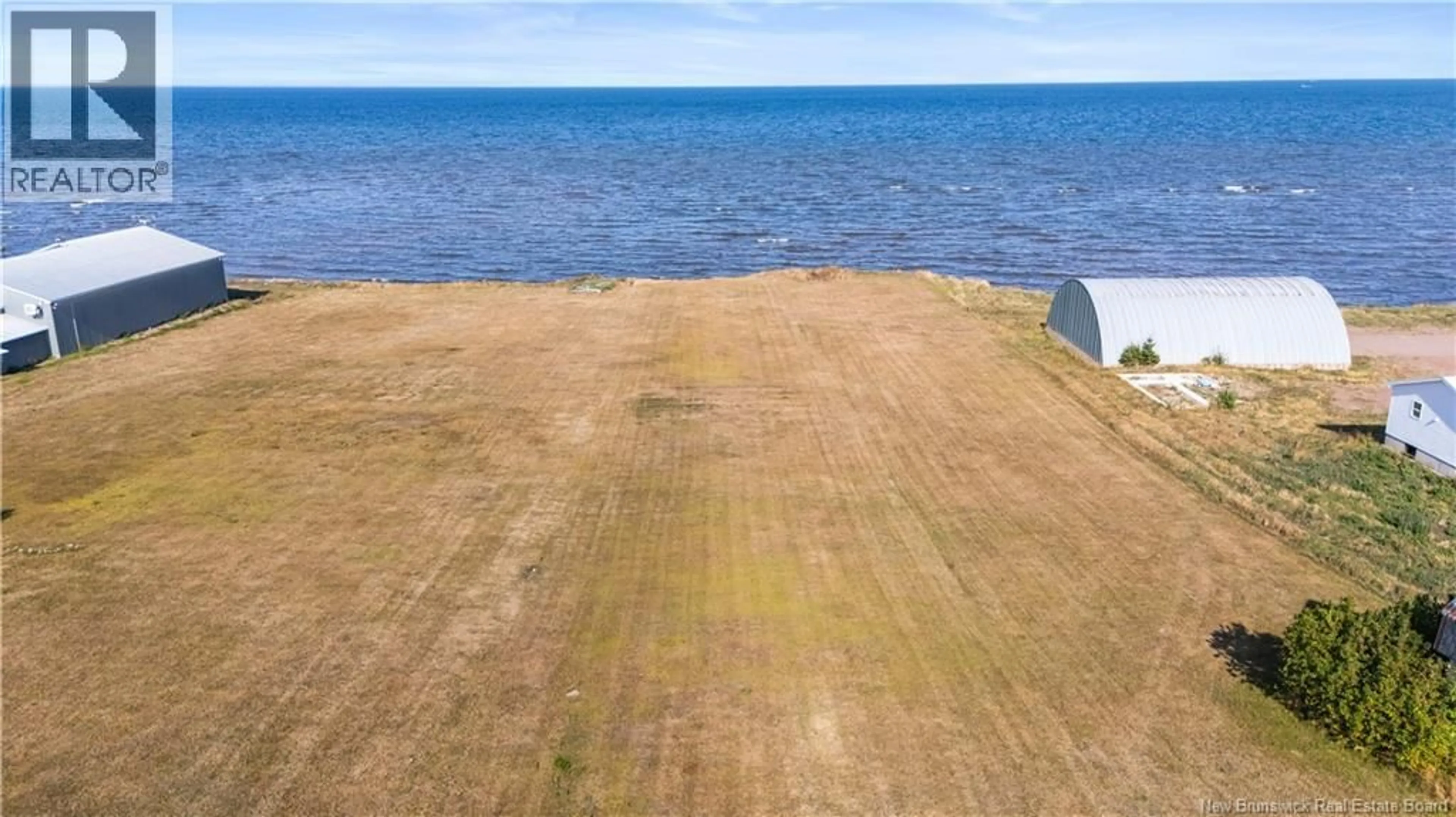 A pic from outside/outdoor area/front of a property/back of a property/a pic from drone, water/lake/river/ocean view for 2106 ROUTE 950 ROUTE, Cap-Pelé New Brunswick E4N2J6