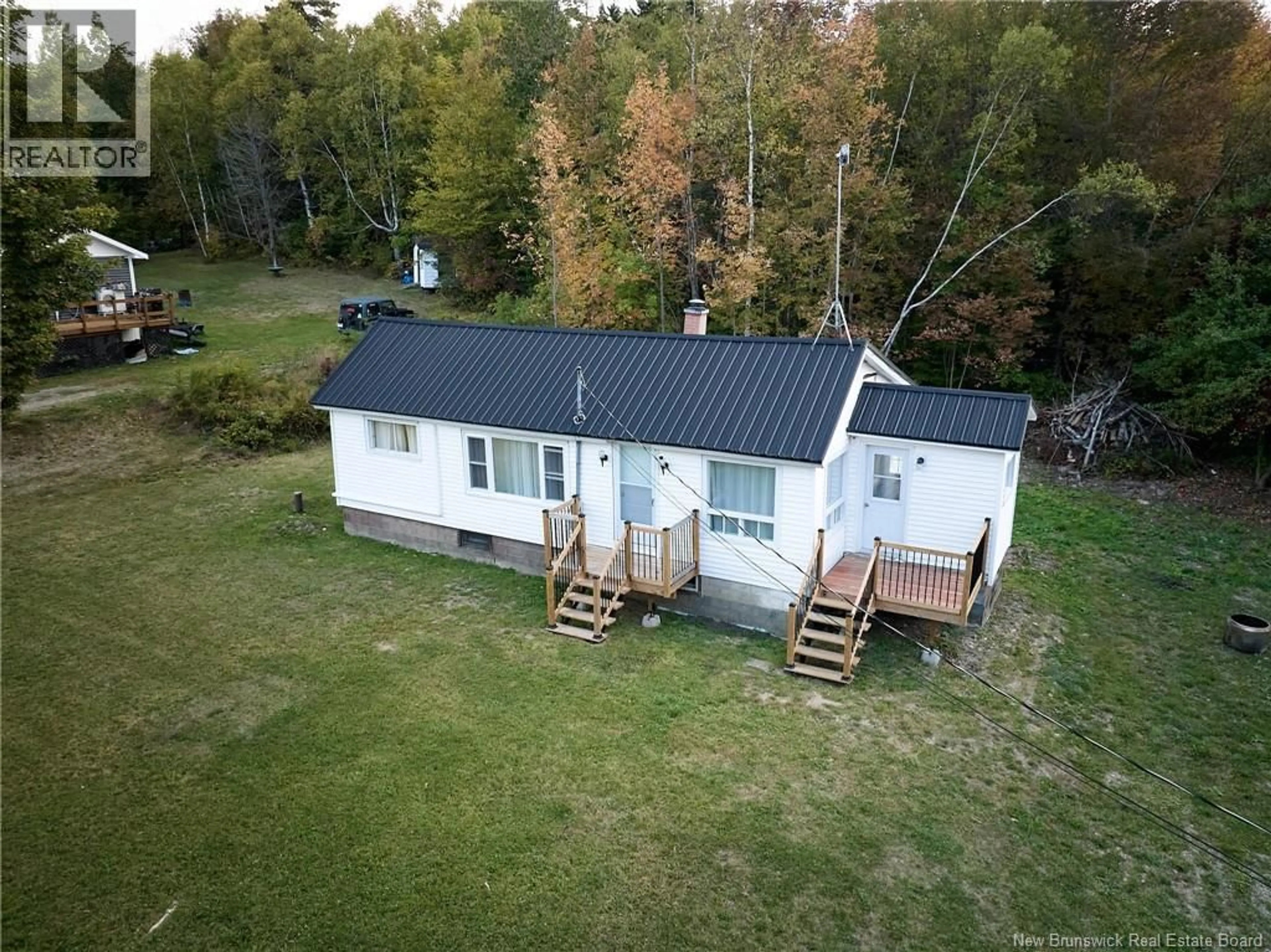 A pic from outside/outdoor area/front of a property/back of a property/a pic from drone, water/lake/river/ocean view for 4032 104 ROUTE, Millville New Brunswick E6E1S9