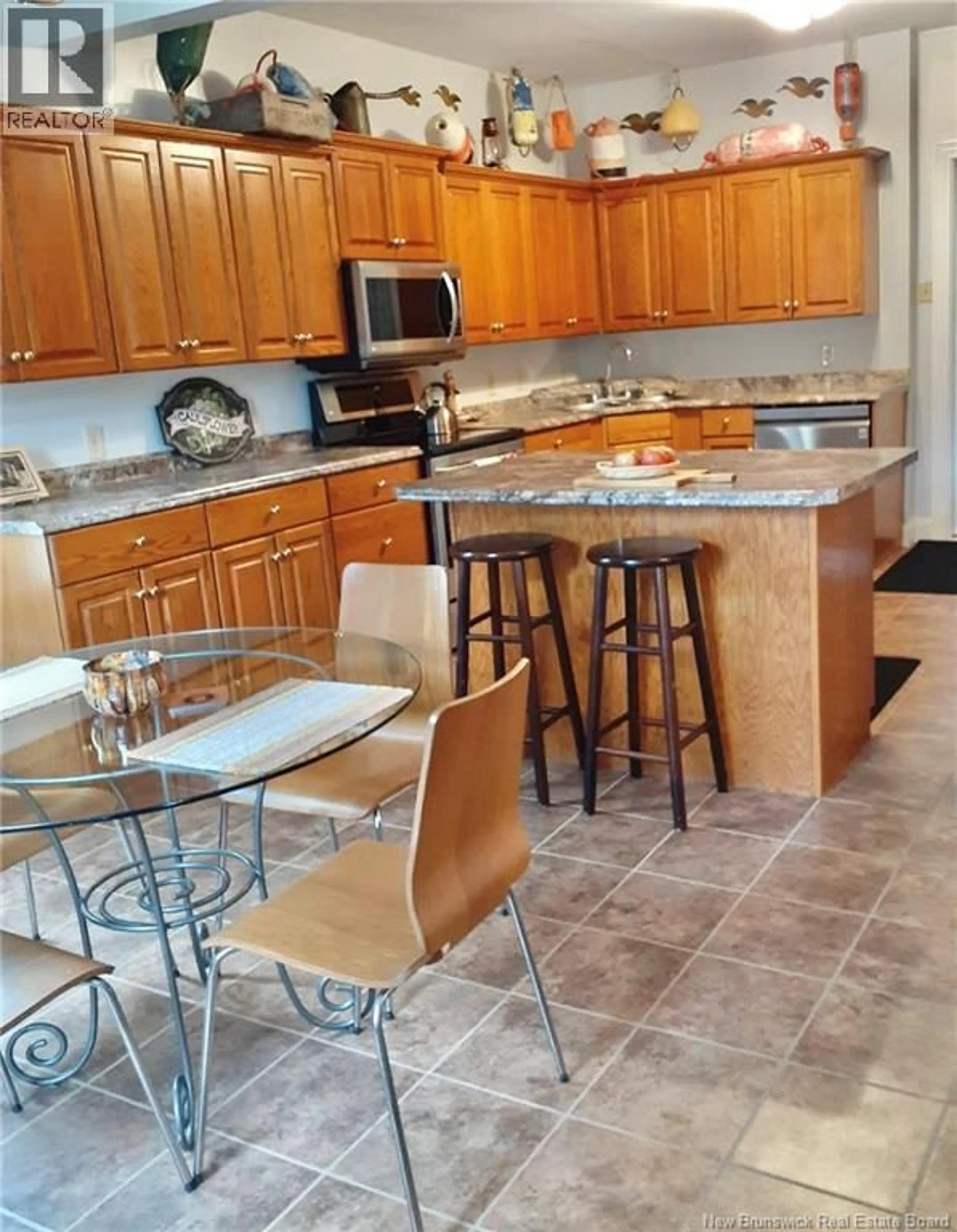 Open concept kitchen, ceramic/tile floor for 13 DEPOT STREET, McAdam New Brunswick E6J1T9