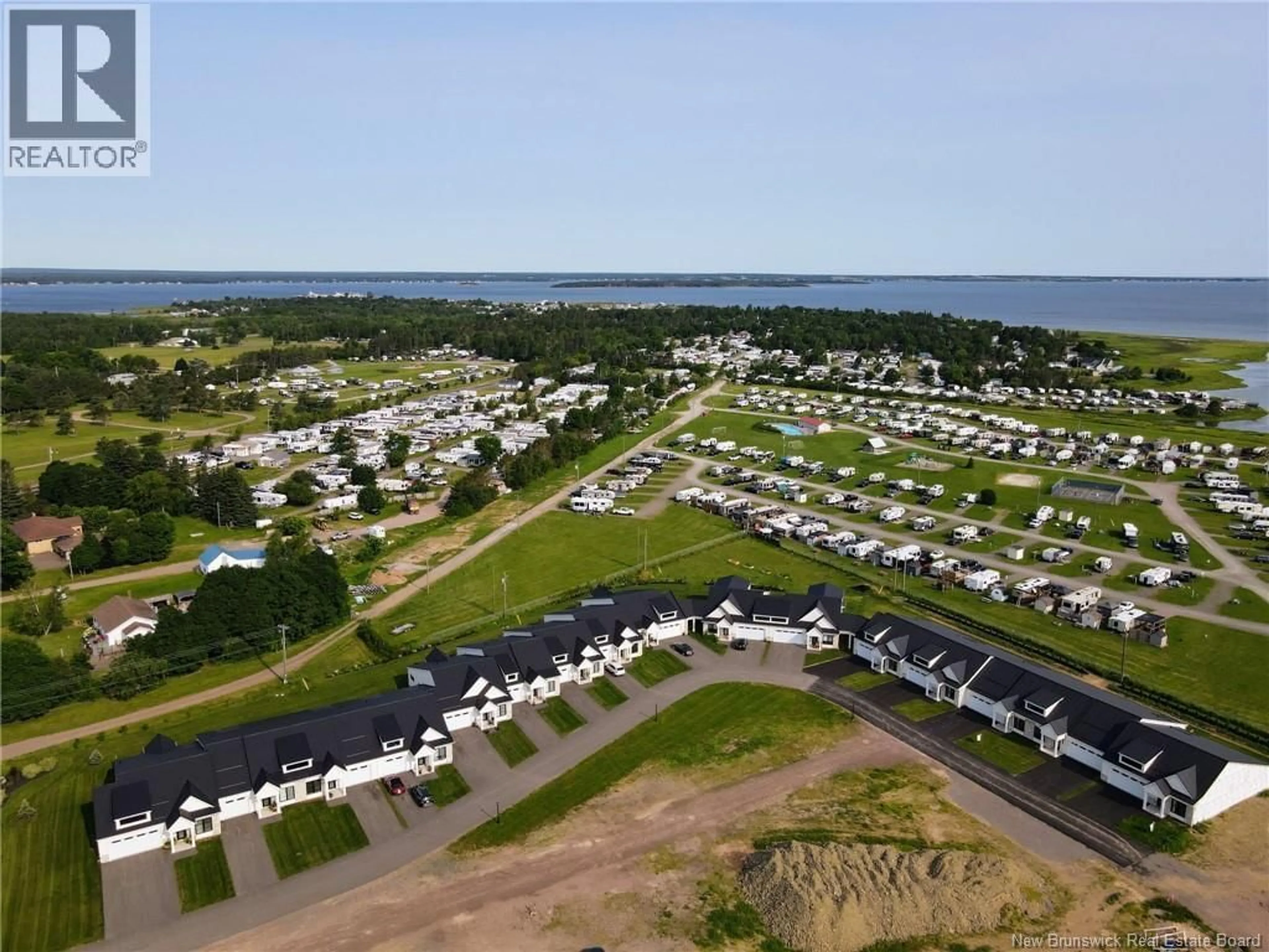 A pic from outside/outdoor area/front of a property/back of a property/a pic from drone, water/lake/river/ocean view for 114 - 724 ROUTE 133, Shediac New Brunswick E4P5A3