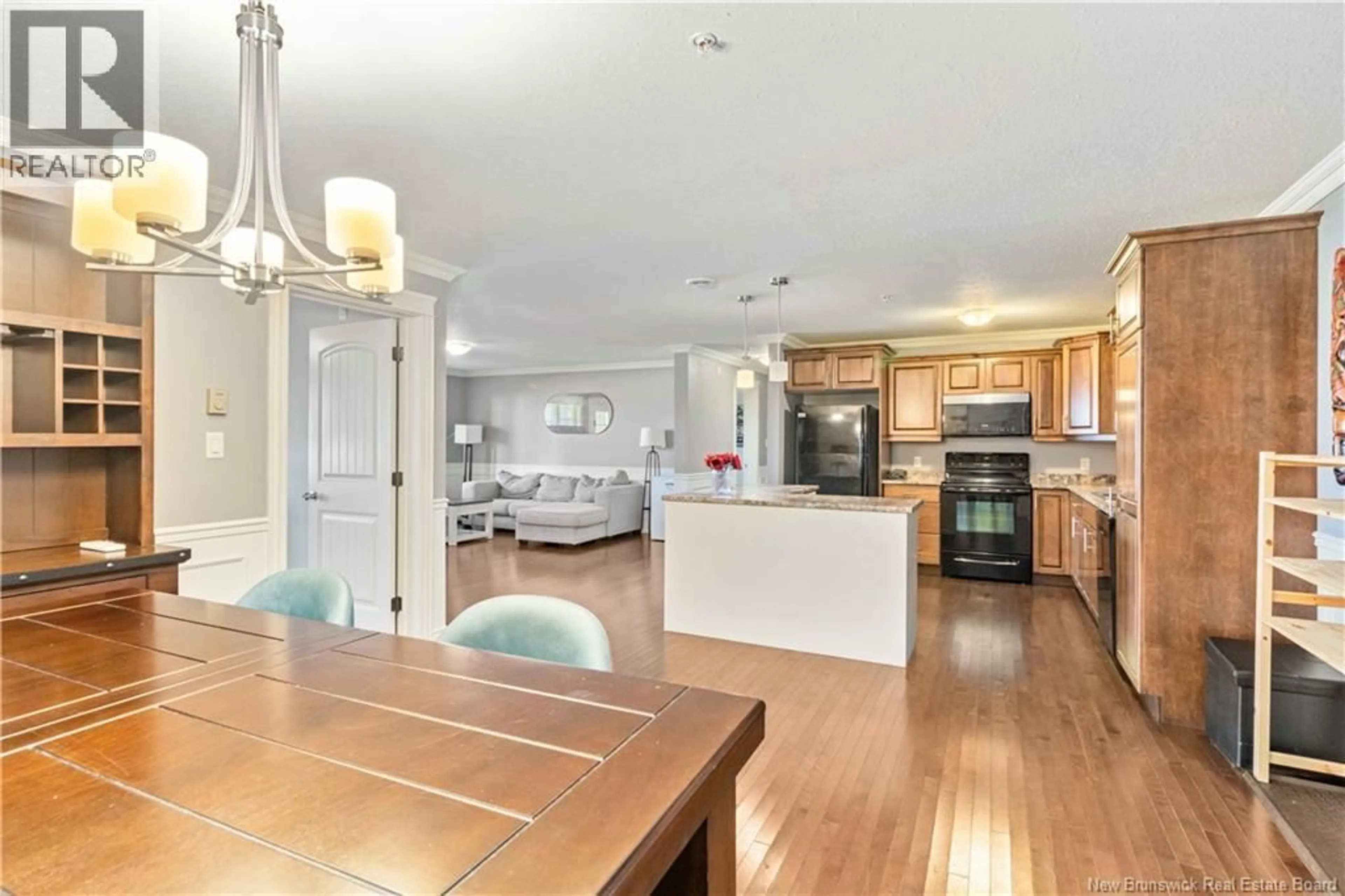 Open concept kitchen, wood/laminate floor for 102 - 155 LIAN STREET, Fredericton New Brunswick E3C0L9