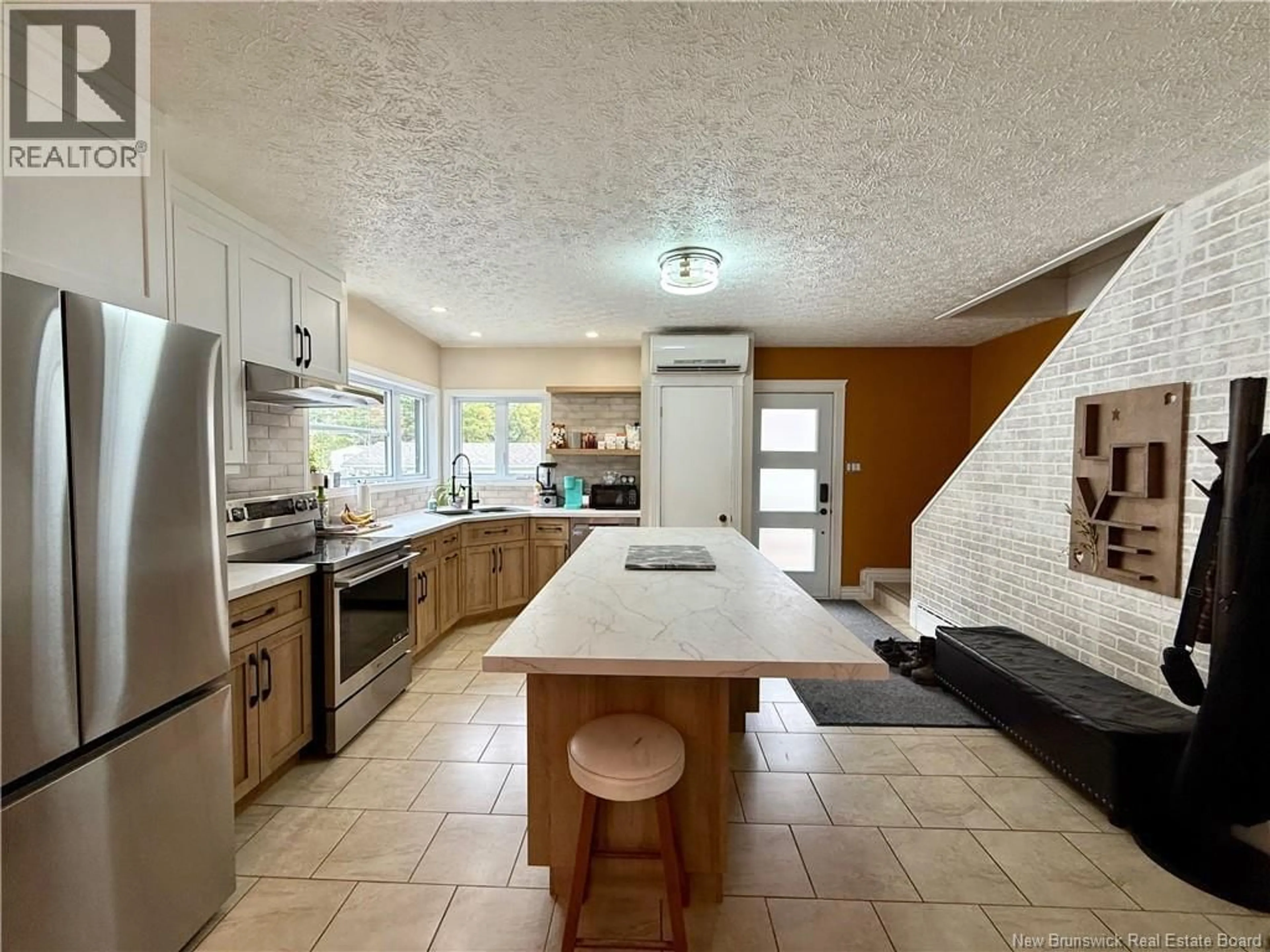 Open concept kitchen, ceramic/tile floor for 23 LAINEY STREET, Edmundston New Brunswick E3V1L6
