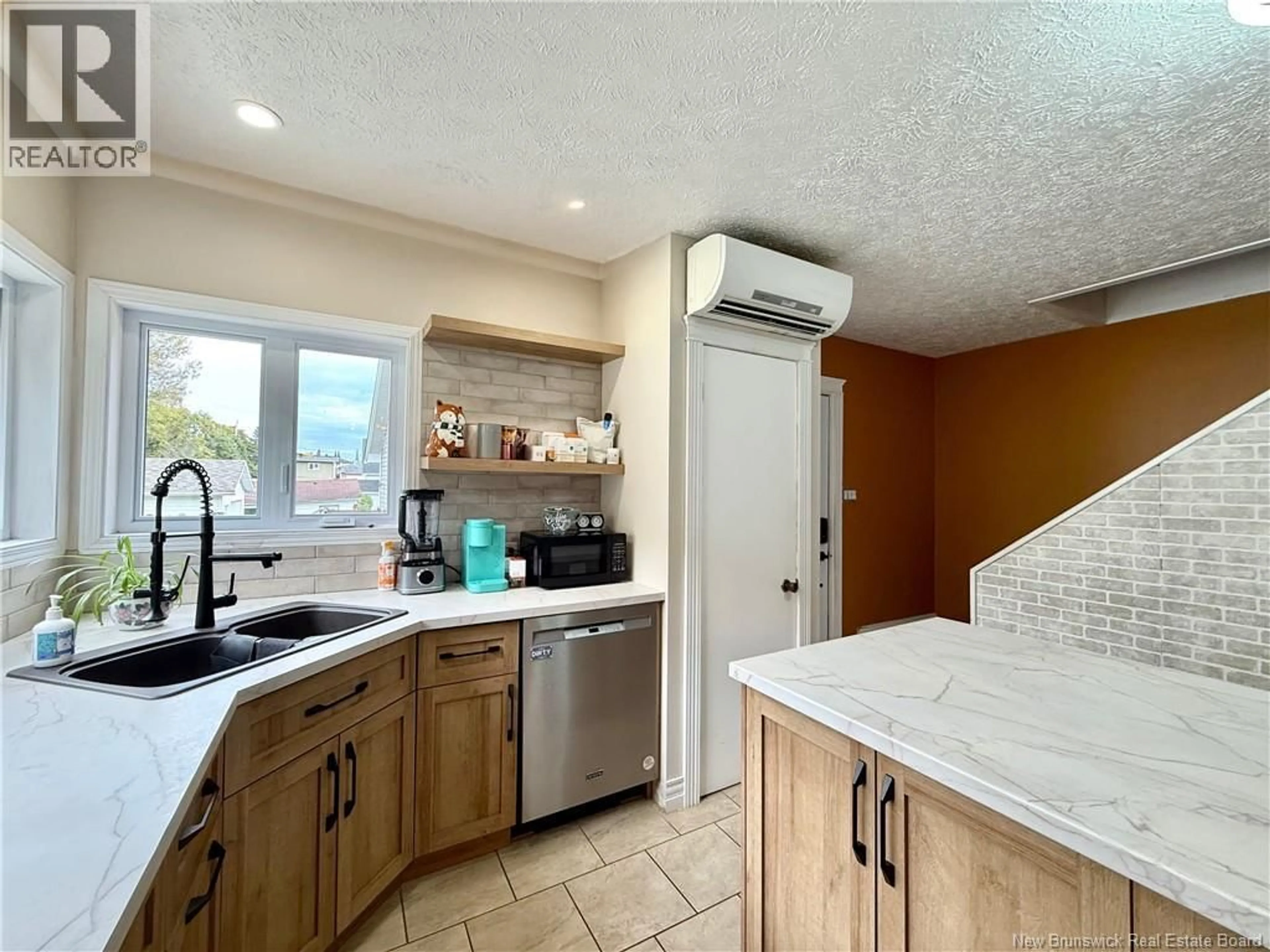 Open concept kitchen, ceramic/tile floor for 23 LAINEY STREET, Edmundston New Brunswick E3V1L6
