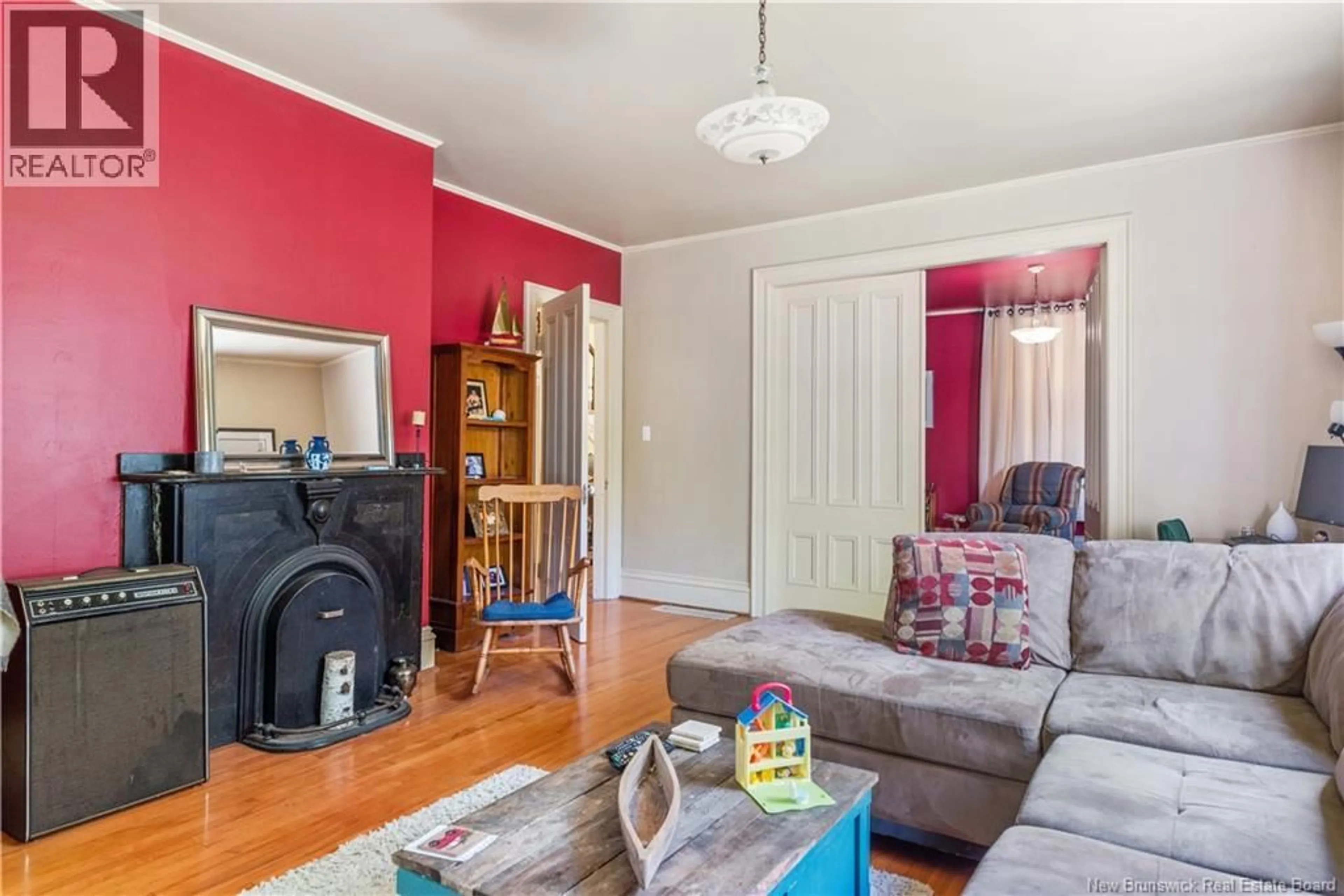 Living room with furniture, wood/laminate floor for 13 MAIN STREET, Sackville New Brunswick E4L4A4
