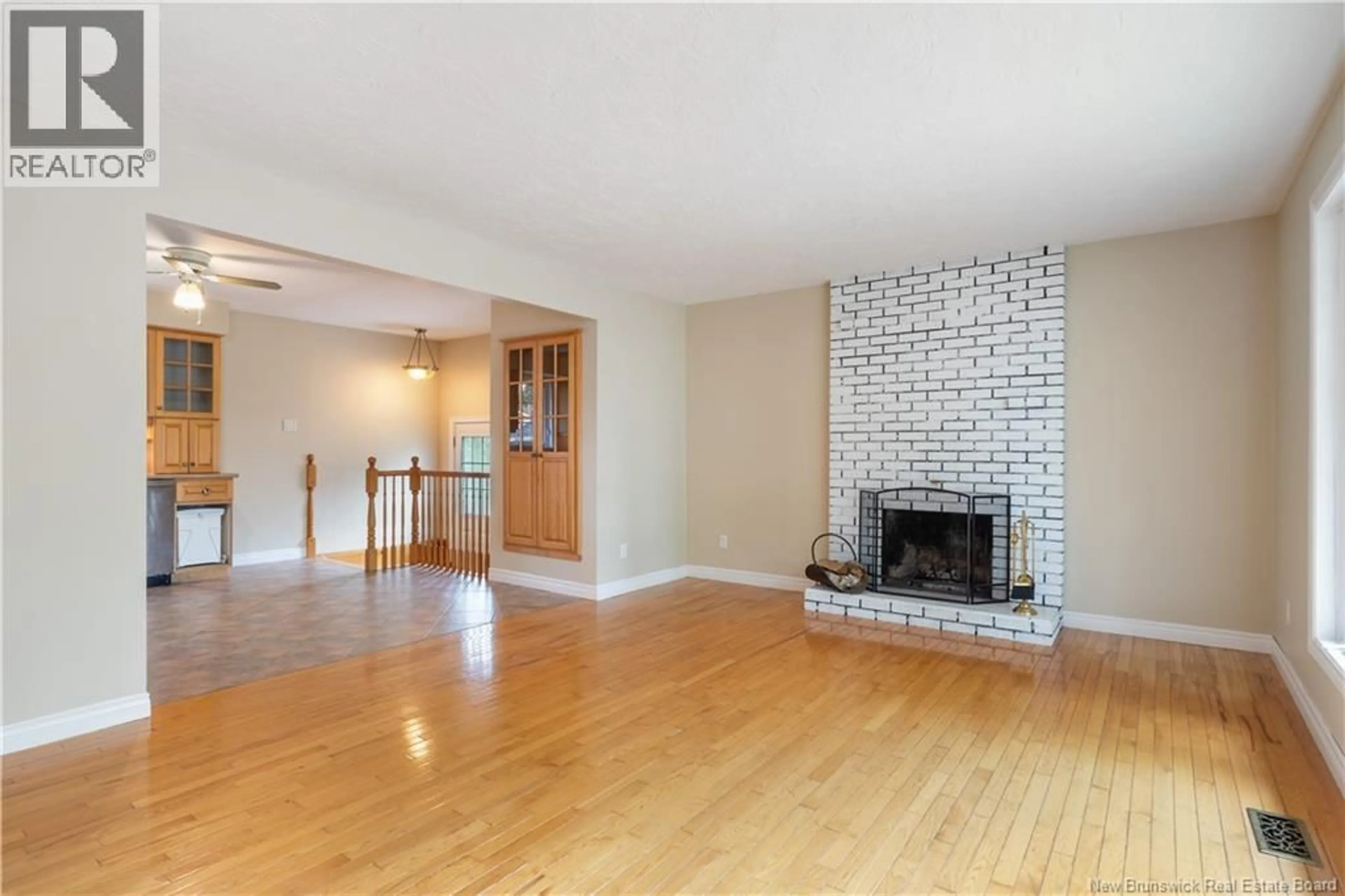 Living room with furniture, wood/laminate floor for 83 WHITNEY, Moncton New Brunswick E1C8C5