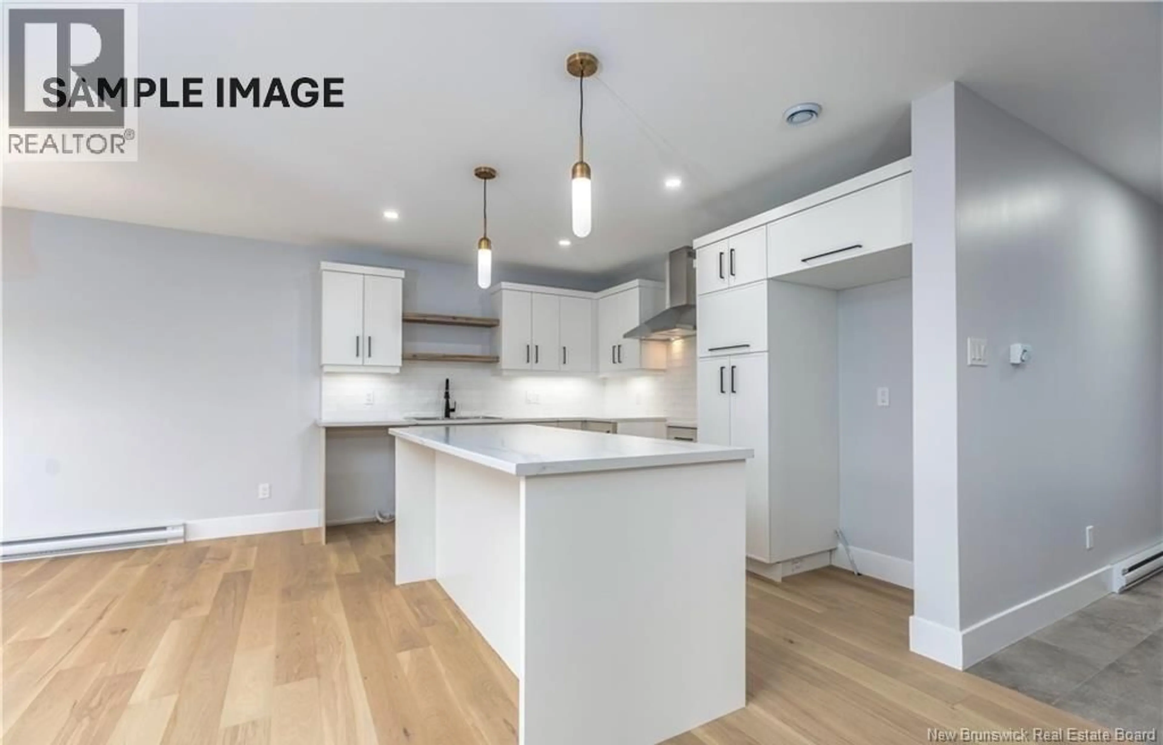 Open concept kitchen, wood/laminate floor for 76 TWIN OAKS DRIVE, Moncton New Brunswick E1G0A1