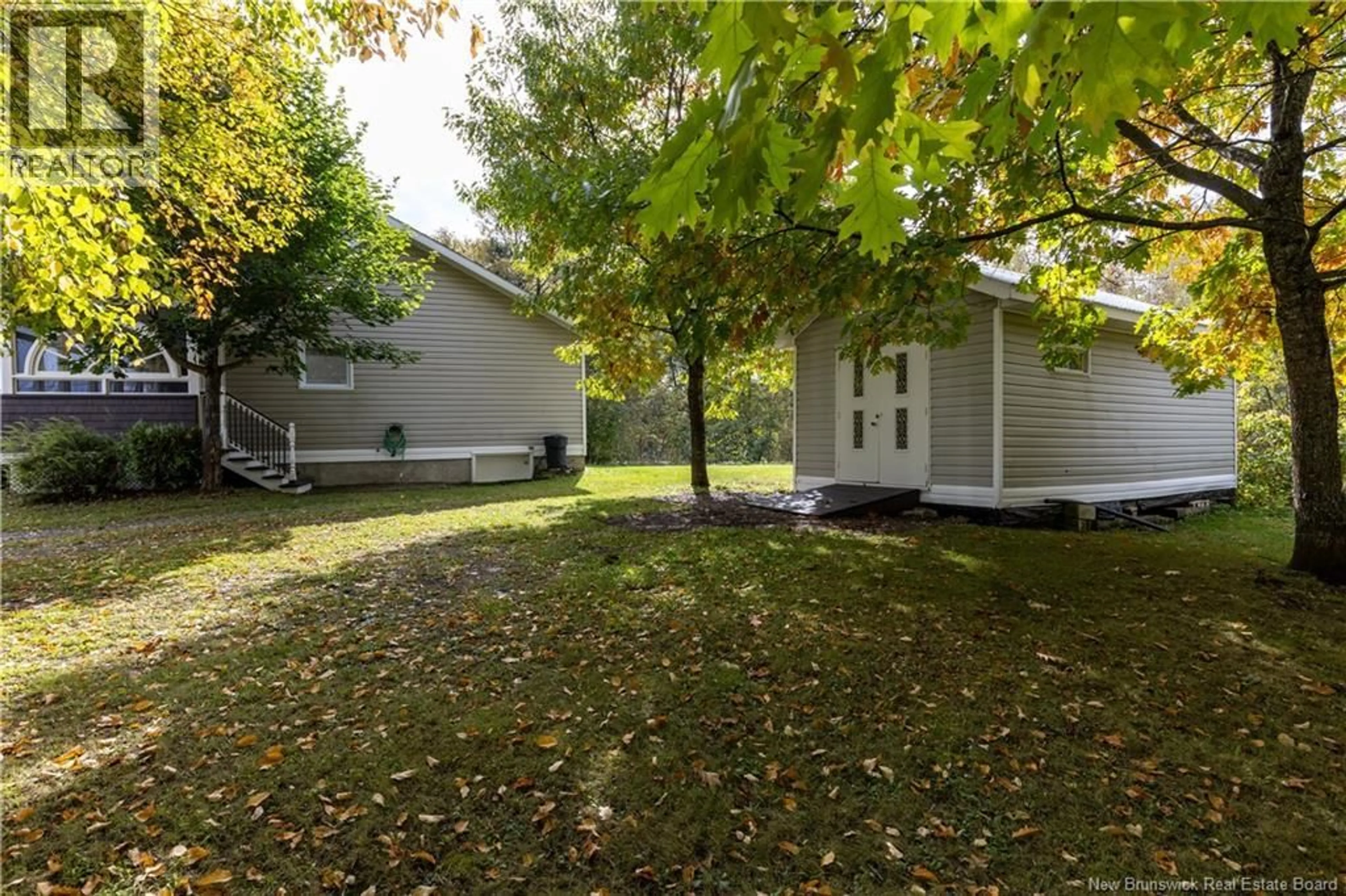 A pic from outside/outdoor area/front of a property/back of a property/a pic from drone, street for 20 CARON LANE, DSL de Drummond/DSL of Drummond New Brunswick E7G1K4