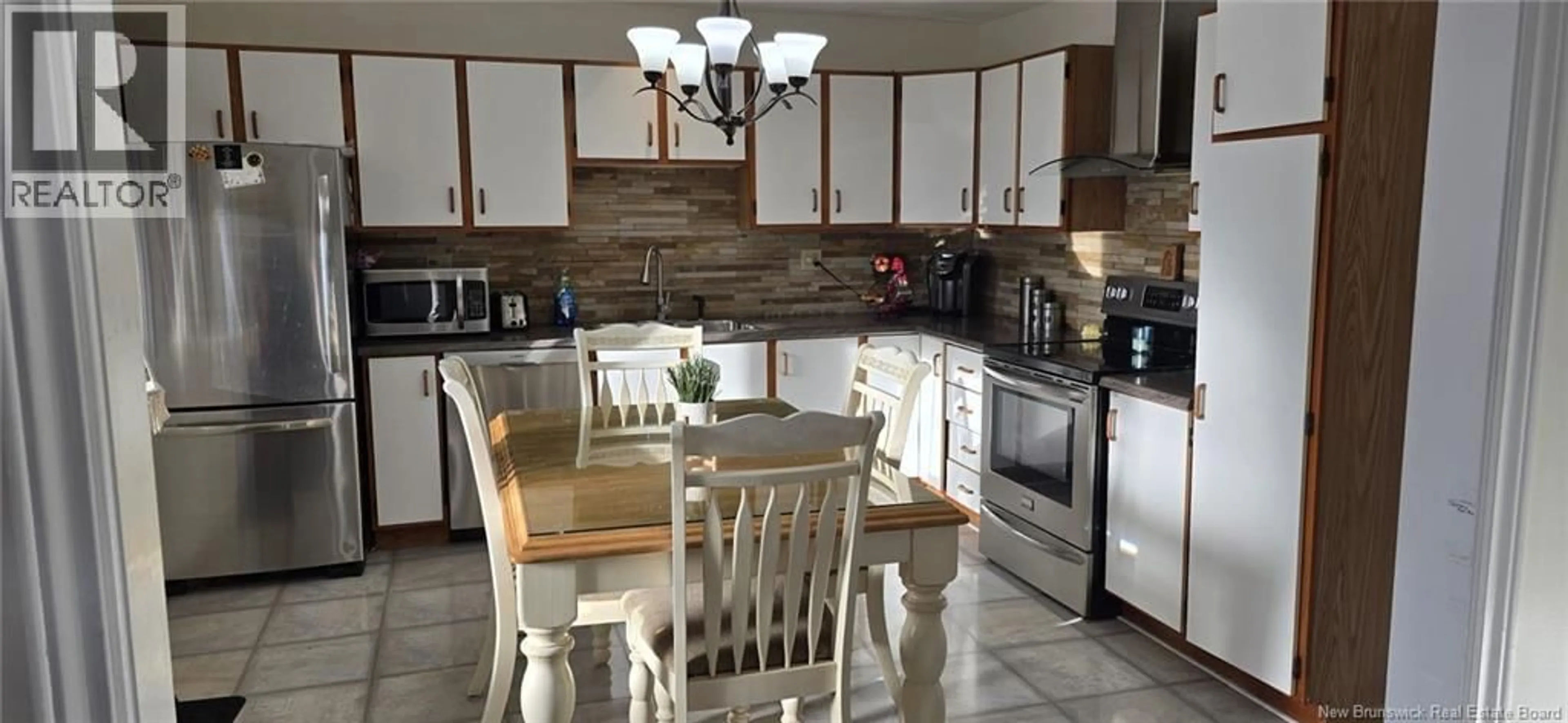 Open concept kitchen, ceramic/tile floor for 48 31 IÈME AVENUE, Edmundston New Brunswick E3V2R5