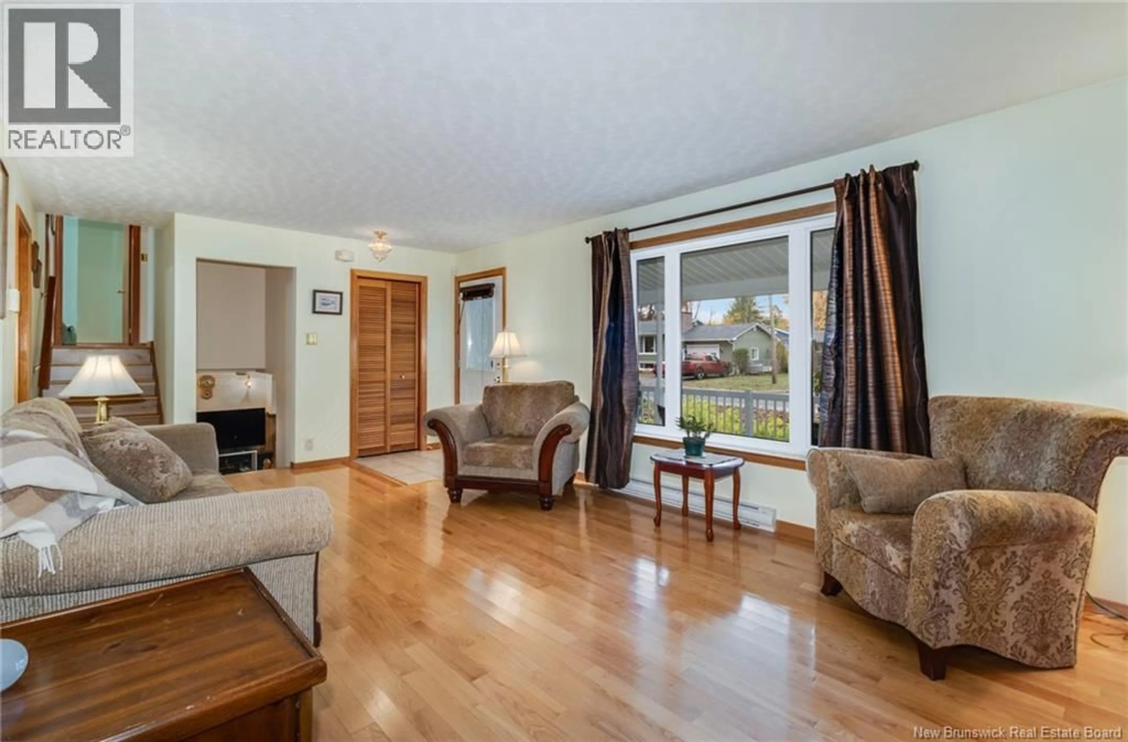 Living room with furniture, wood/laminate floor for 14 HARTT STREET, Fredericton New Brunswick E3A4X1