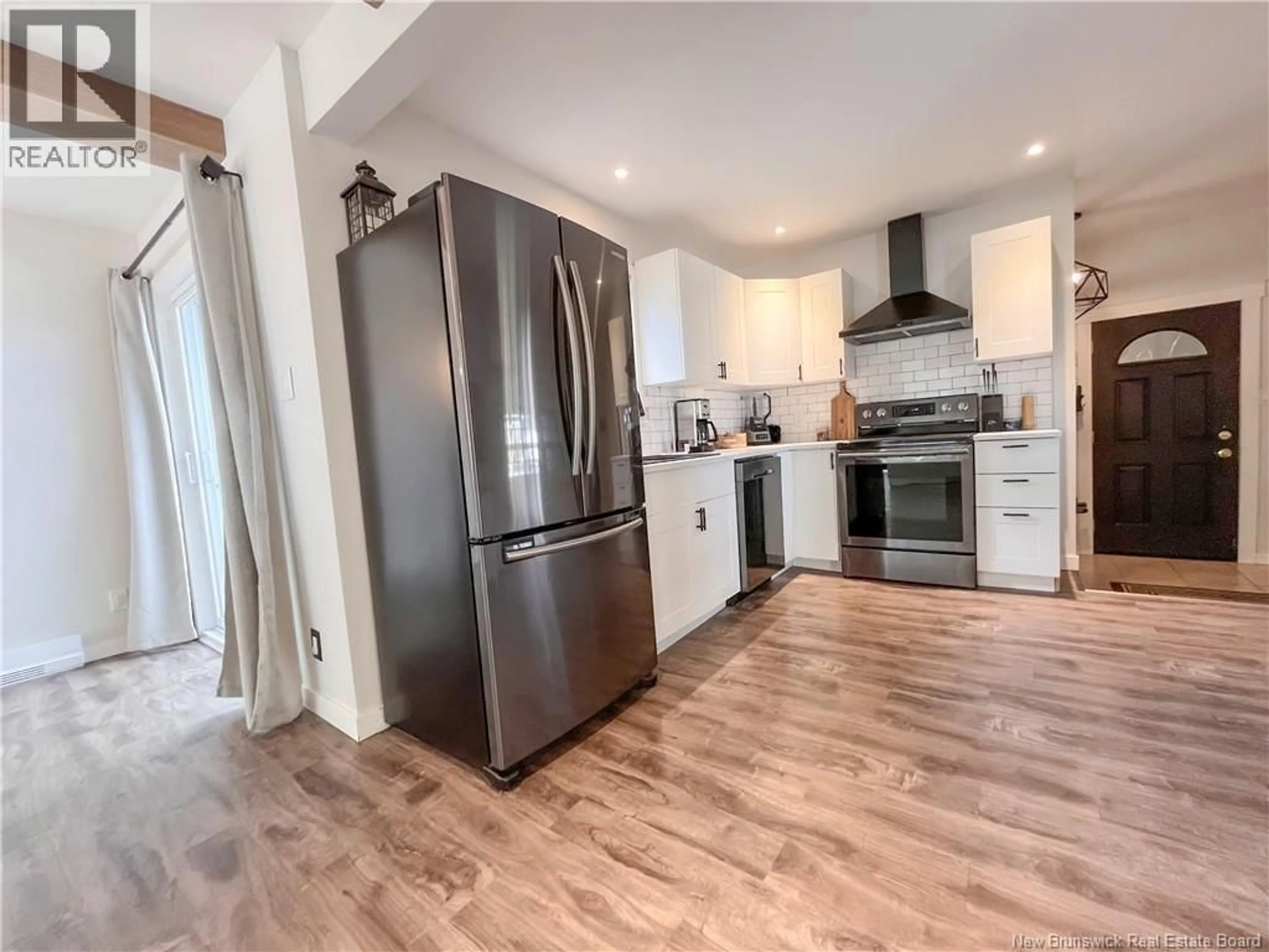Open concept kitchen, wood/laminate floor for 209 KINGSWAY AVENUE, Miramichi New Brunswick E1V3B9