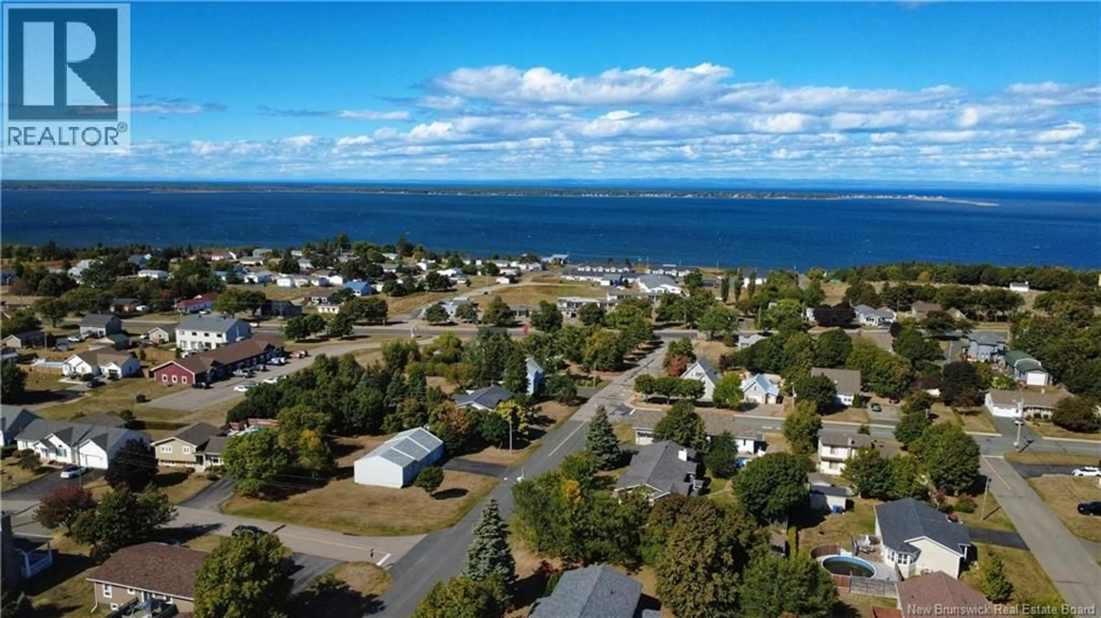 A pic from outside/outdoor area/front of a property/back of a property/a pic from drone, water/lake/river/ocean view for 8 RUE BOURGEOIS, Caraquet New Brunswick E1W1A4