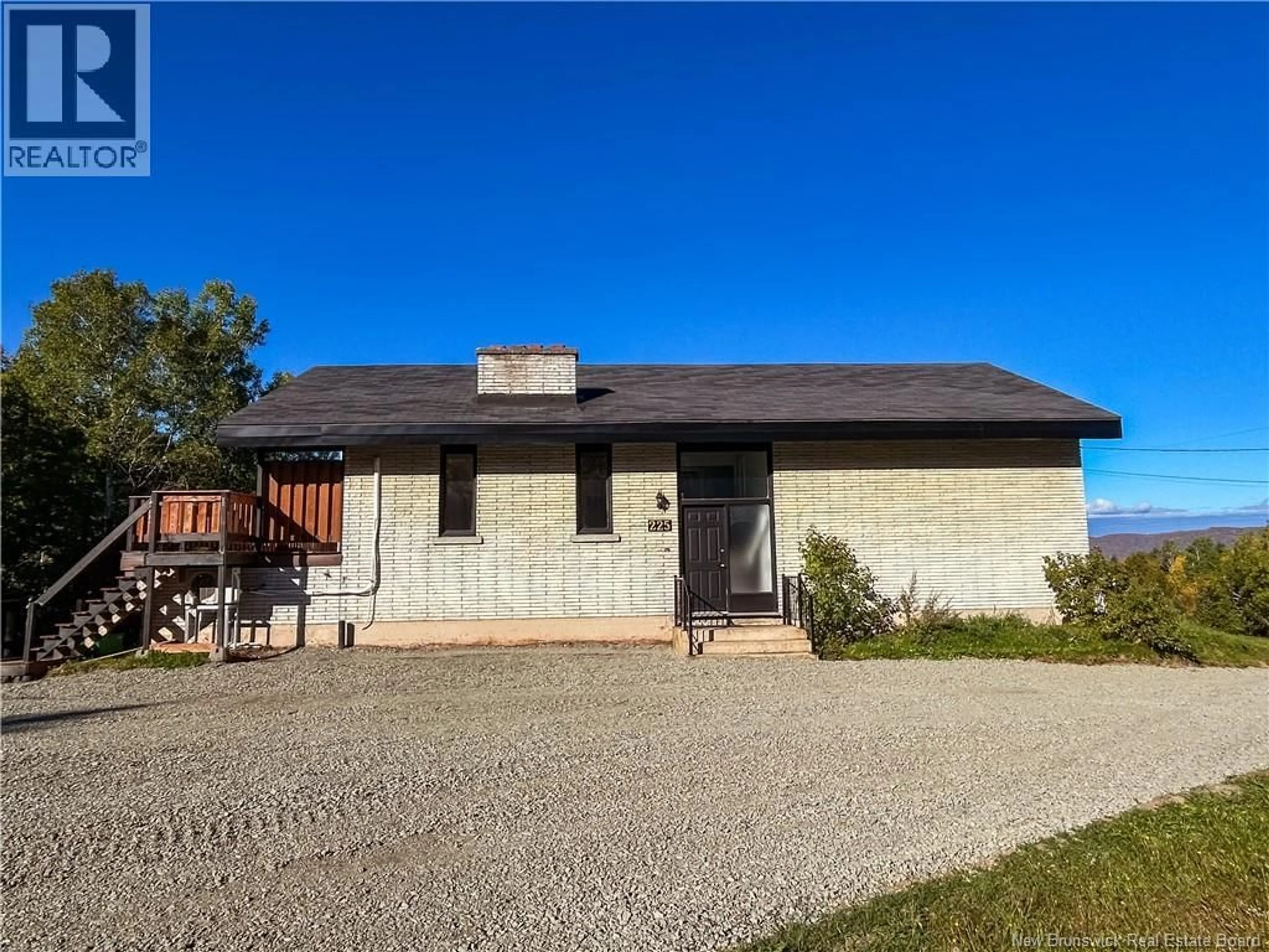 Home with brick exterior material, street for 225 LILY LAKE ROAD, Campbellton New Brunswick E3N3K1