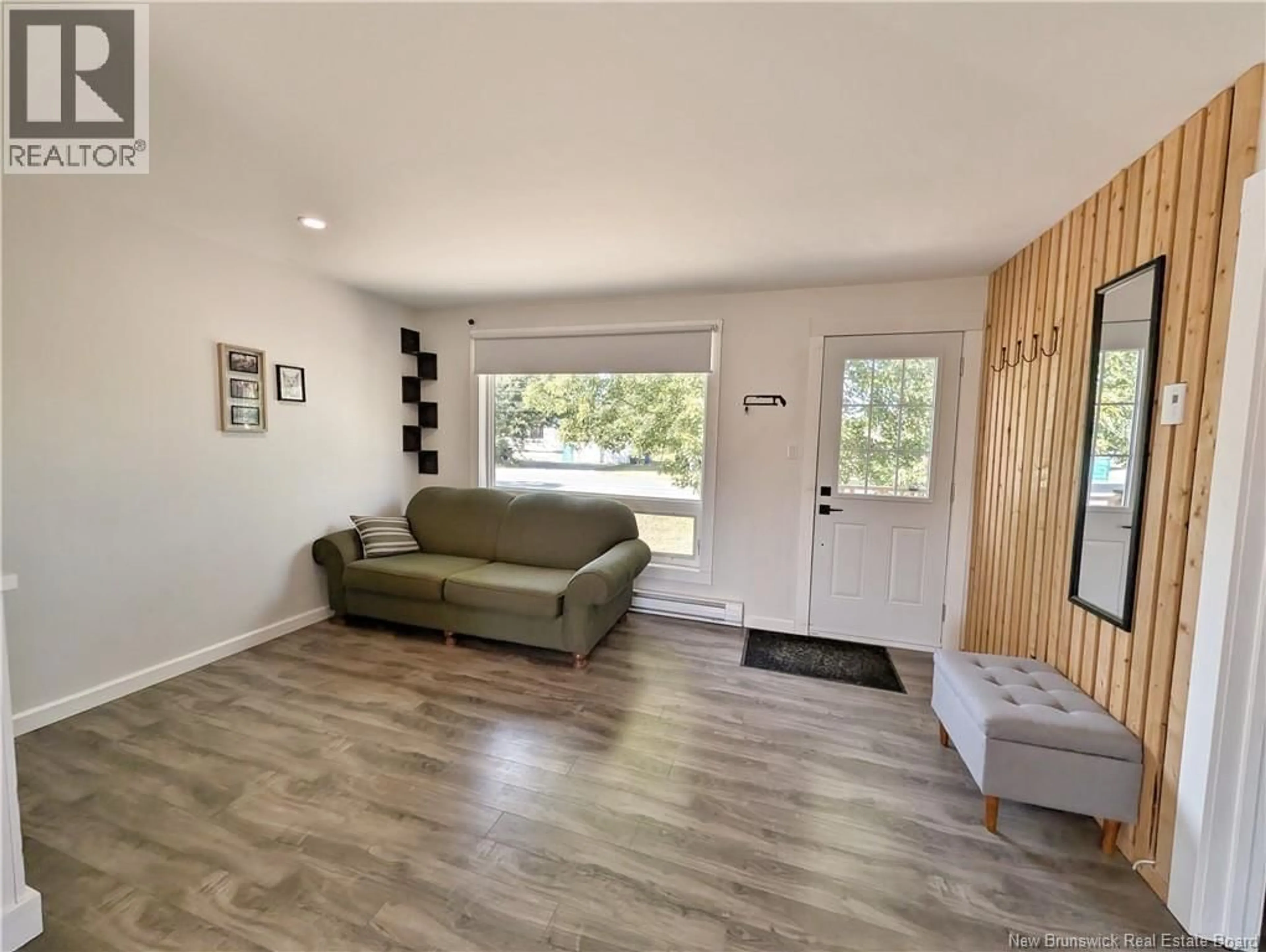 Living room with furniture, wood/laminate floor for 749 SAINT-JOSEPH BOULEVARD, Saint-Léolin New Brunswick E8N2N3