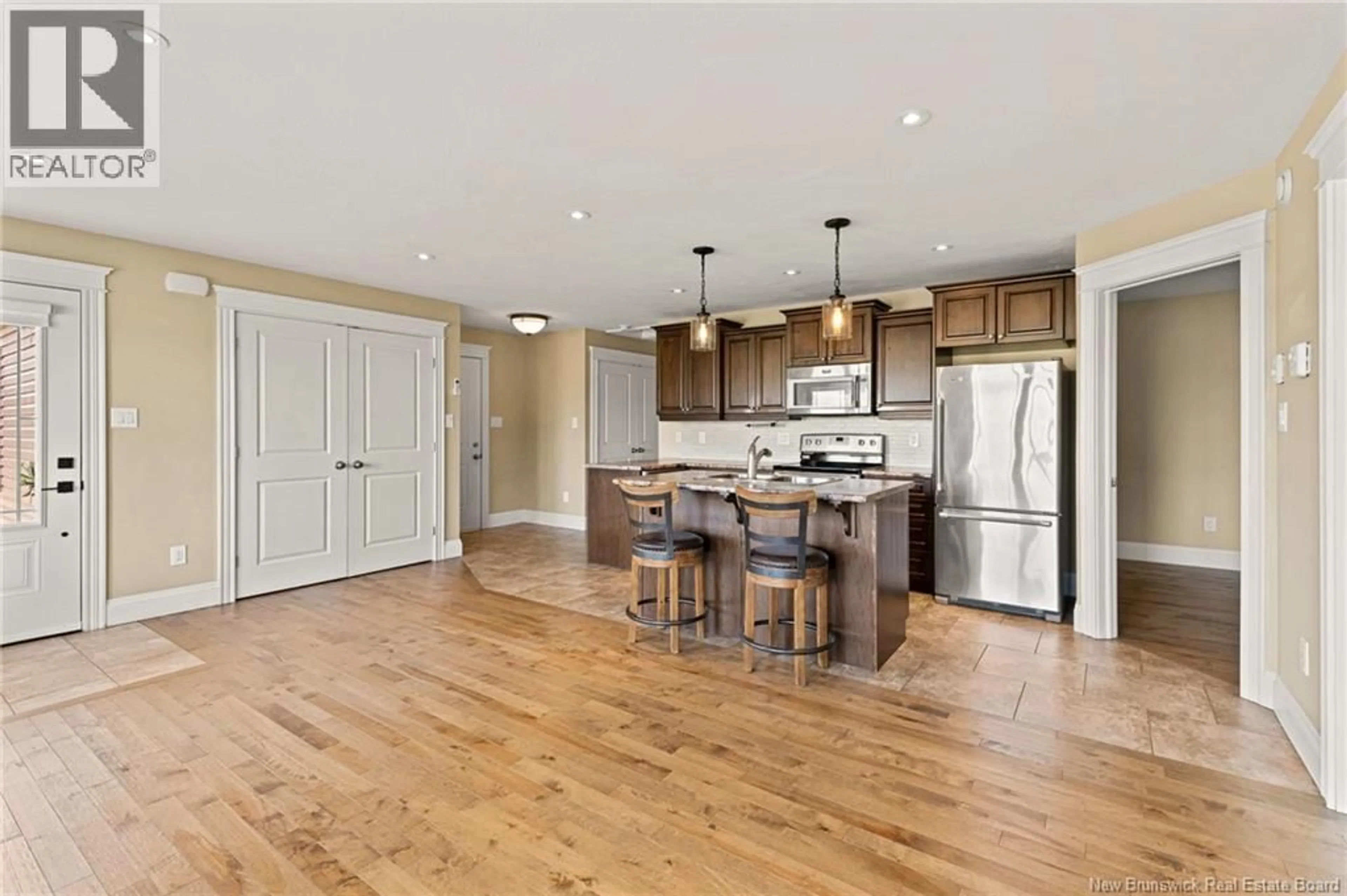 Open concept kitchen, wood/laminate floor for 99 COCAGNE CROSS ROAD, Cocagne New Brunswick E4R2J1